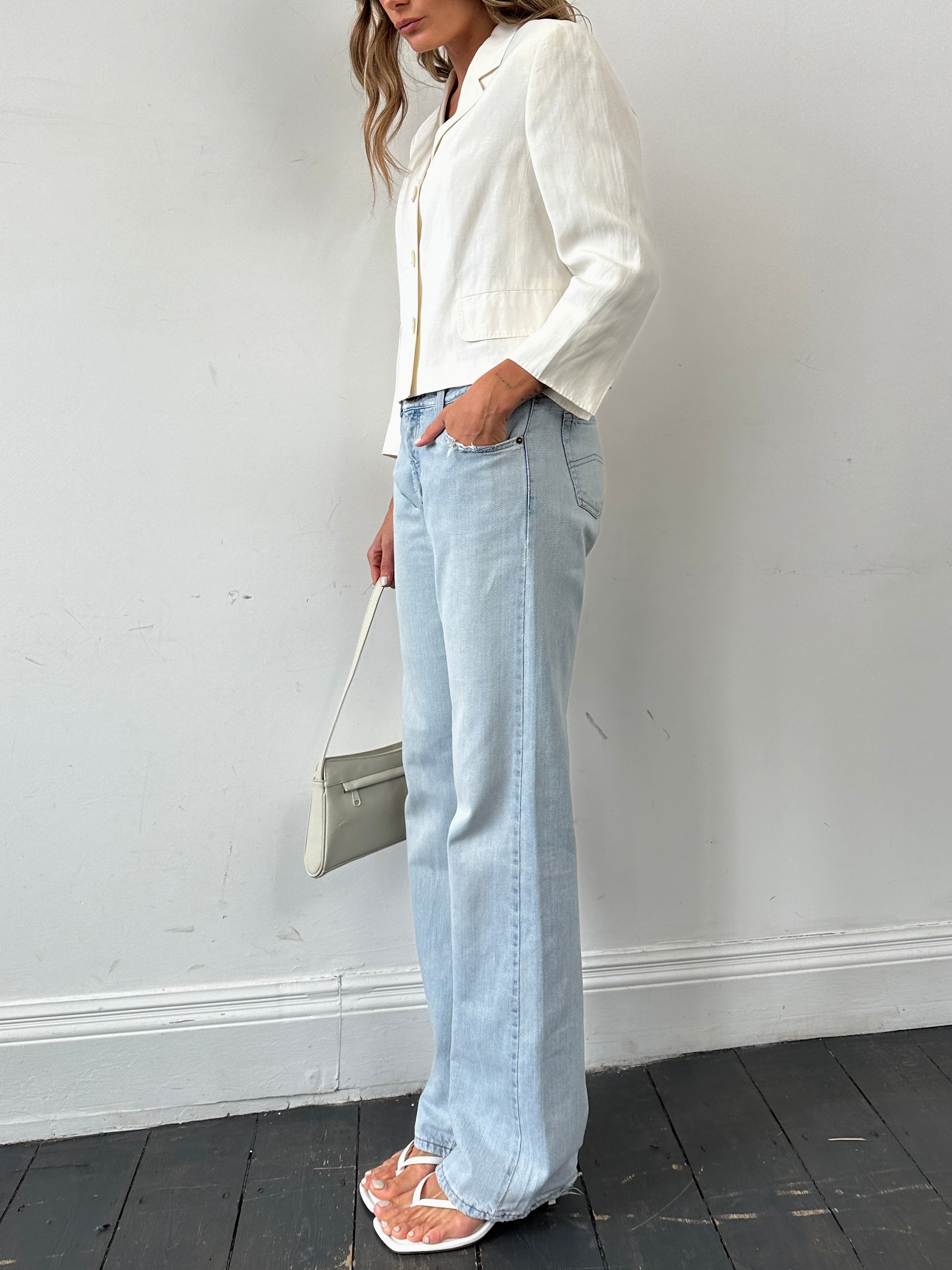 Armani Jeans light wash mid-rise denim jeans with W30 waist, displayed on a hanger with a casual fit.