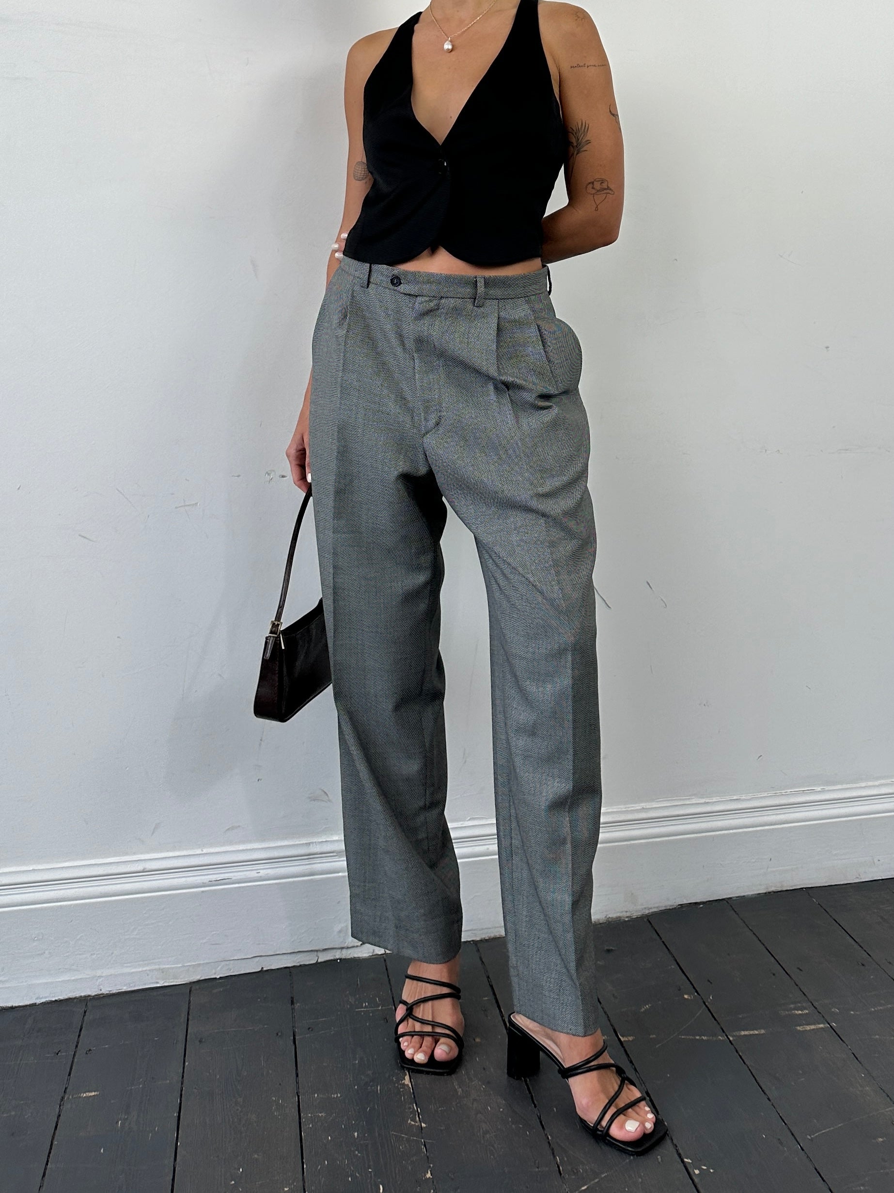 Yves Saint Laurent straight leg high waisted tailored trousers in W35, shown on a hanger with a clean, classic design.