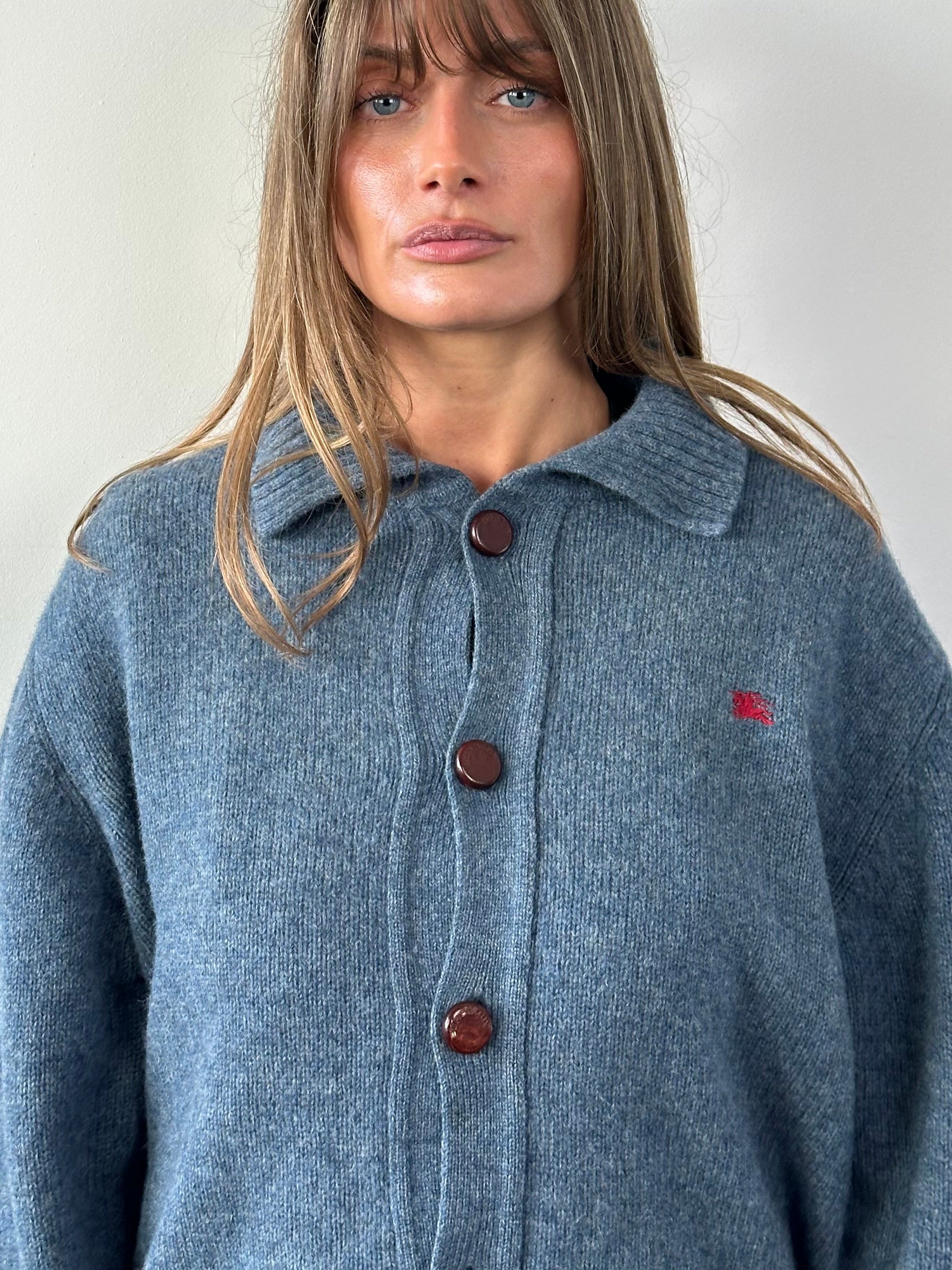 Burberry London wool knitted logo cardigan in M/L, featuring a classic design with the Burberry check pattern and logo detail.