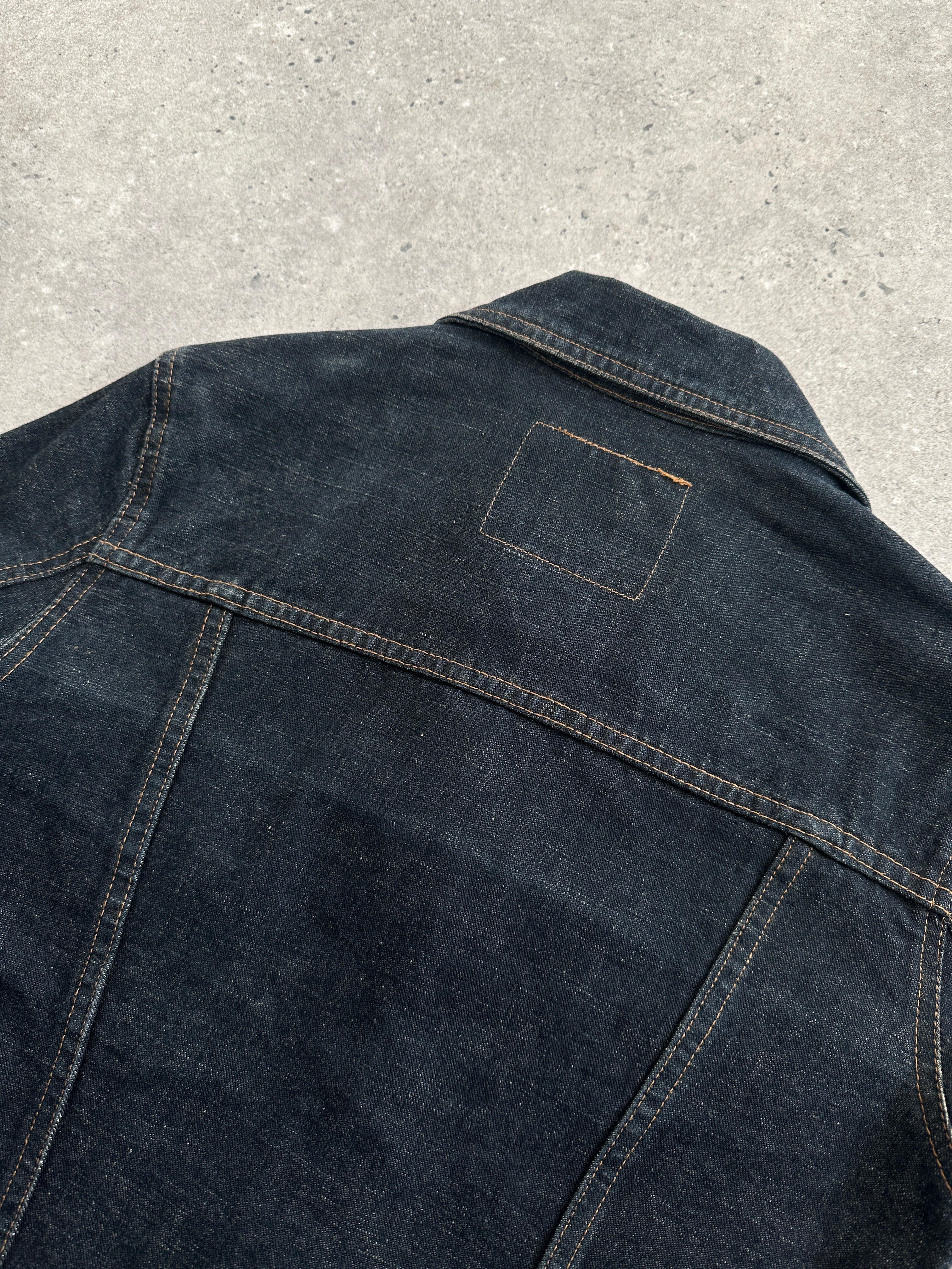 Vintage Italian vintage fitted raw denim jacket in size XS/S, showing classic collar and button front detail.