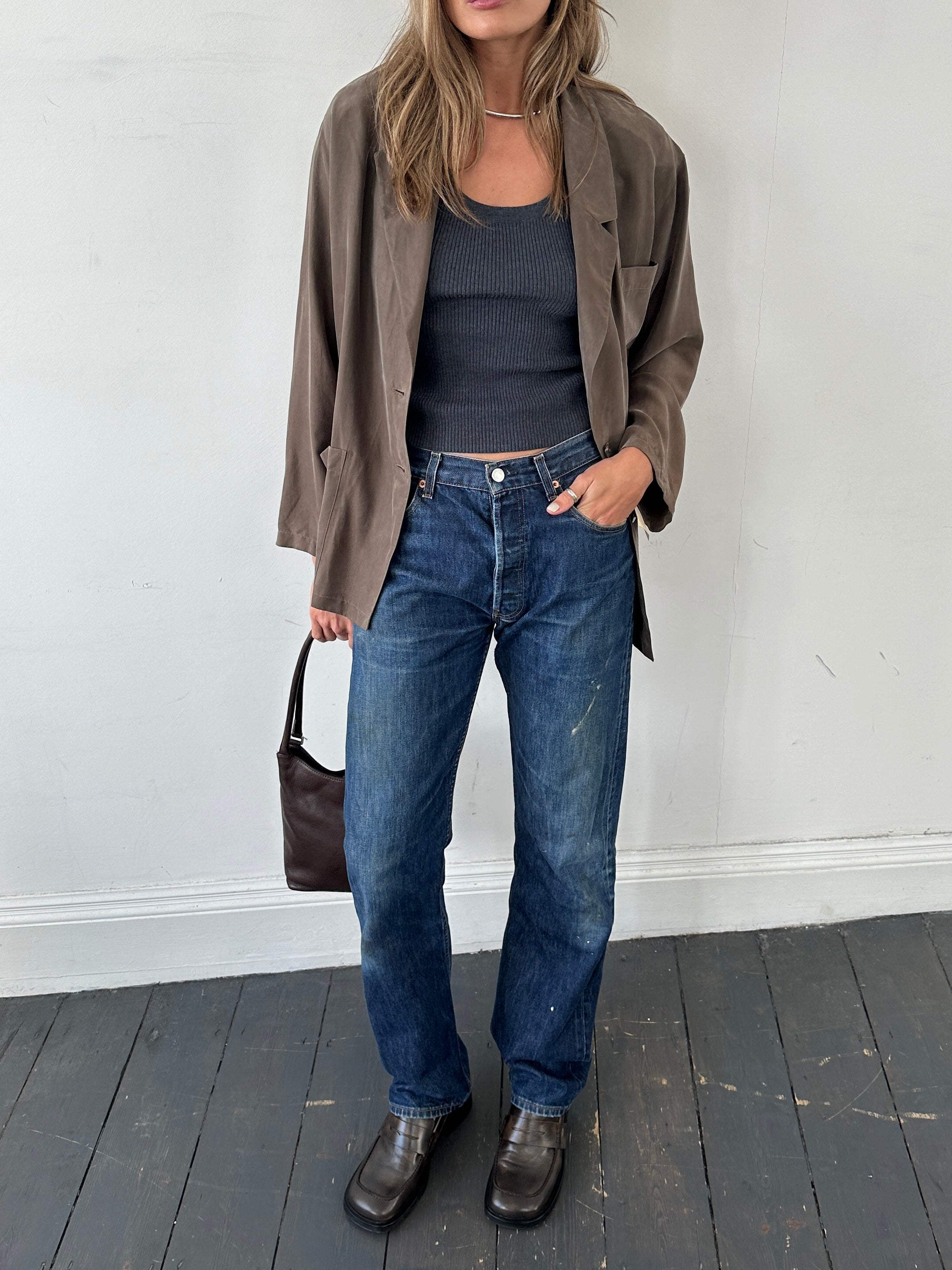 Levi’s 501 distressed straight leg denim jeans in W30, showing faded and ripped details on classic blue denim fabric.