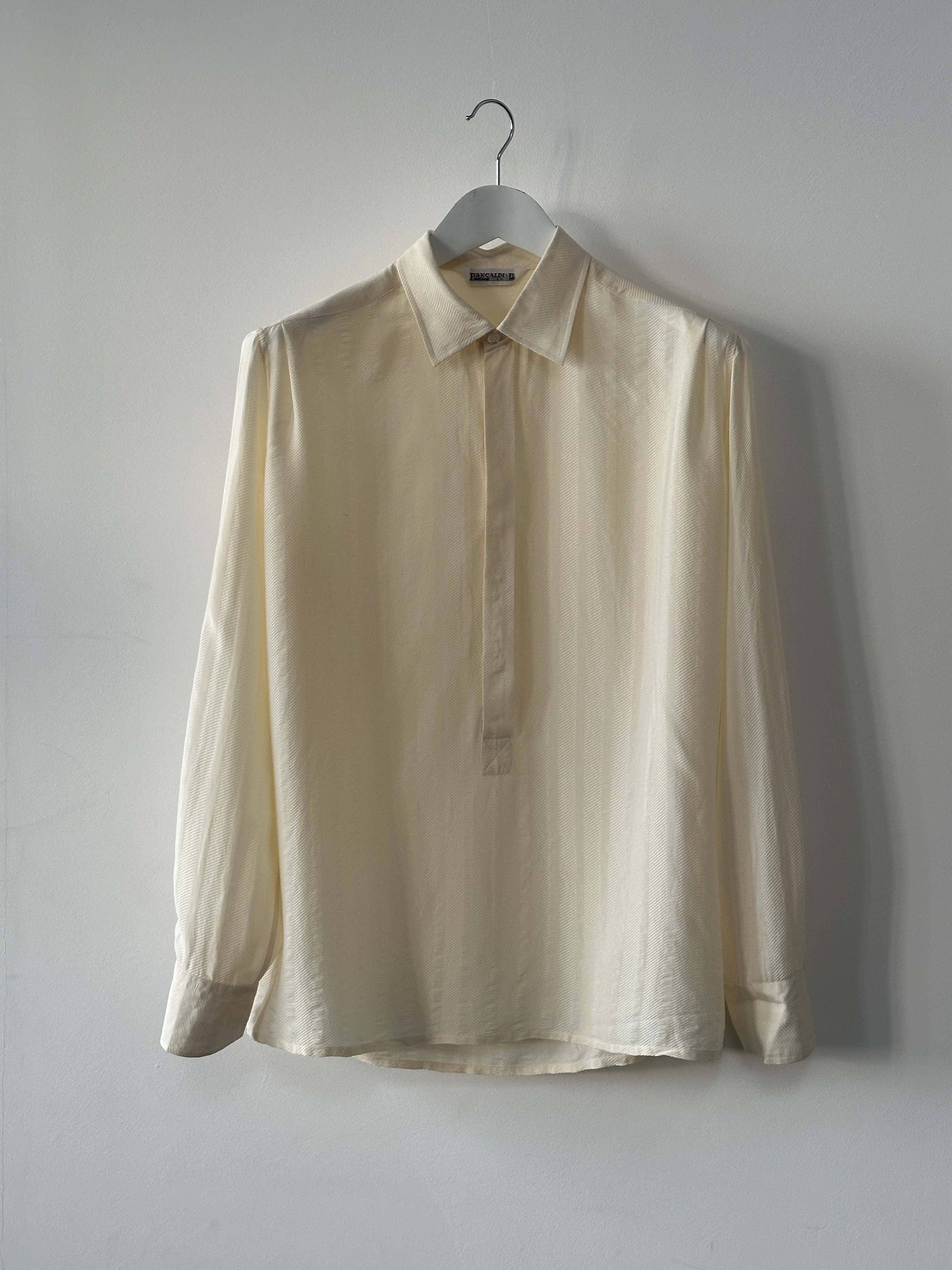 Vintage pure silk polo shirt in size L/XL, featuring a classic design and smooth fabric, ideal for stylish casual wear.
