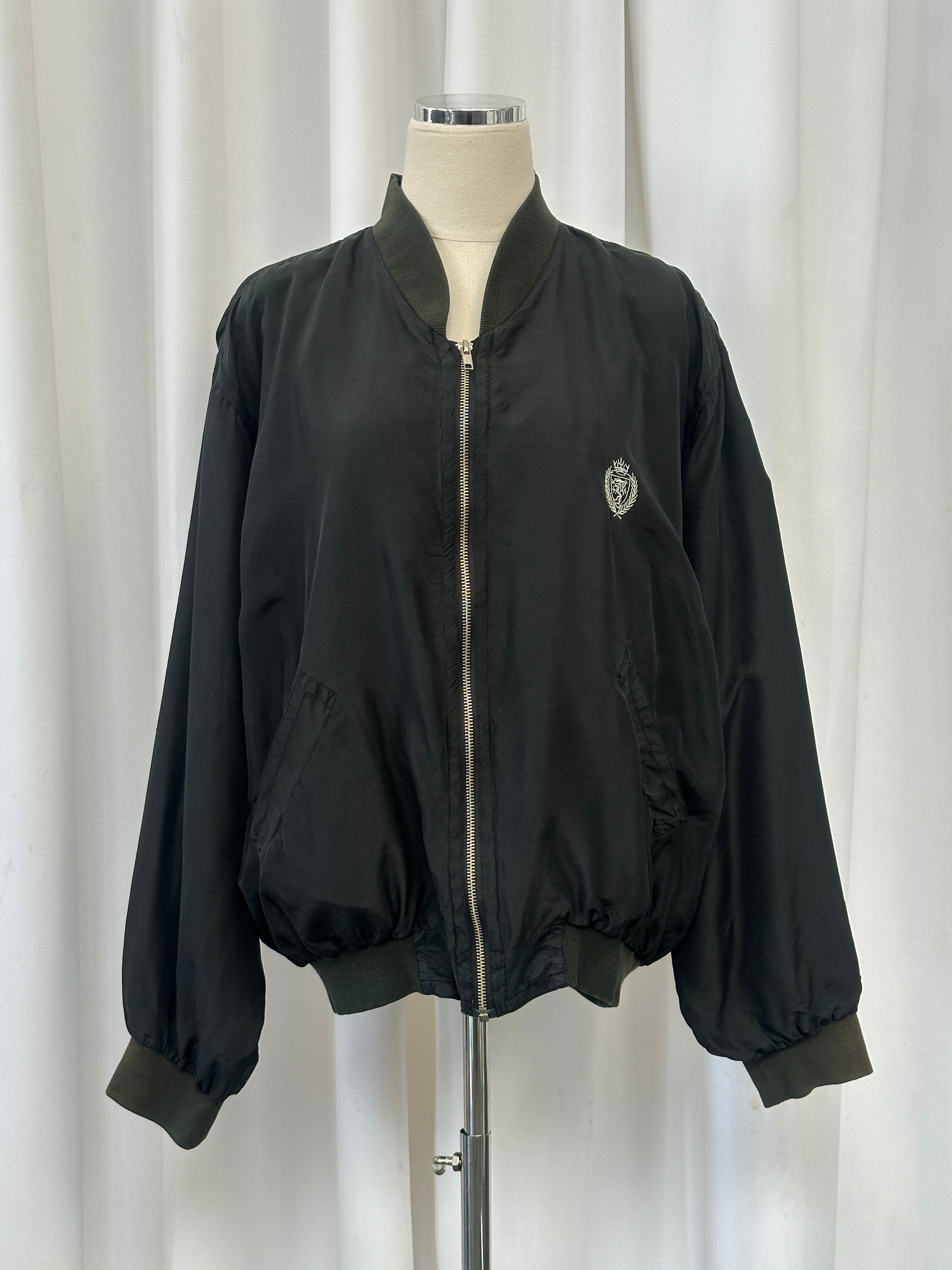 Vintage 1990s pure silk bomber jacket in size M/L with a sleek, shiny finish and classic style.