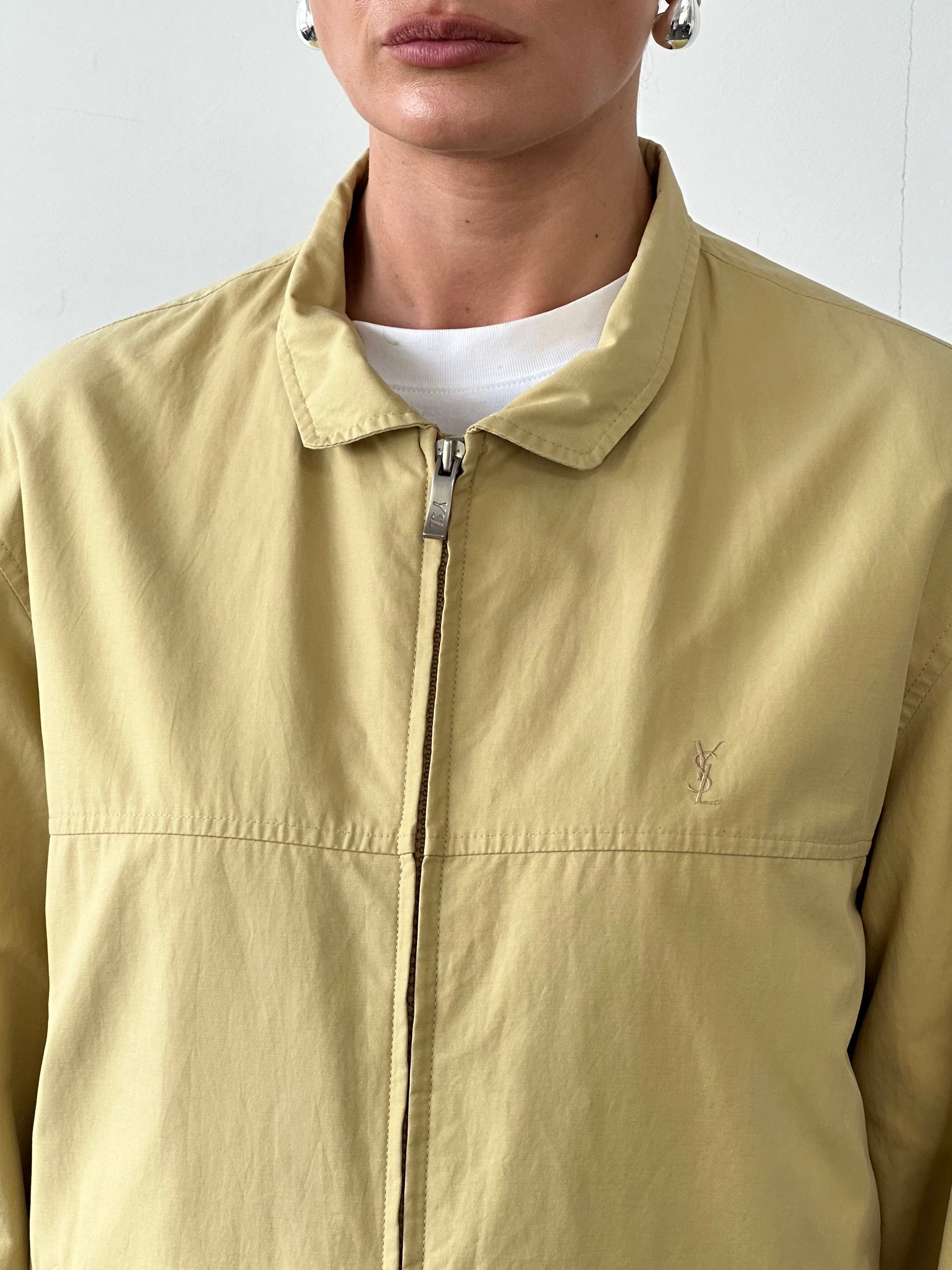Yves Saint Laurent Pour Homme logo bomber jacket in size L, black with YSL branding, displayed on a hanger.