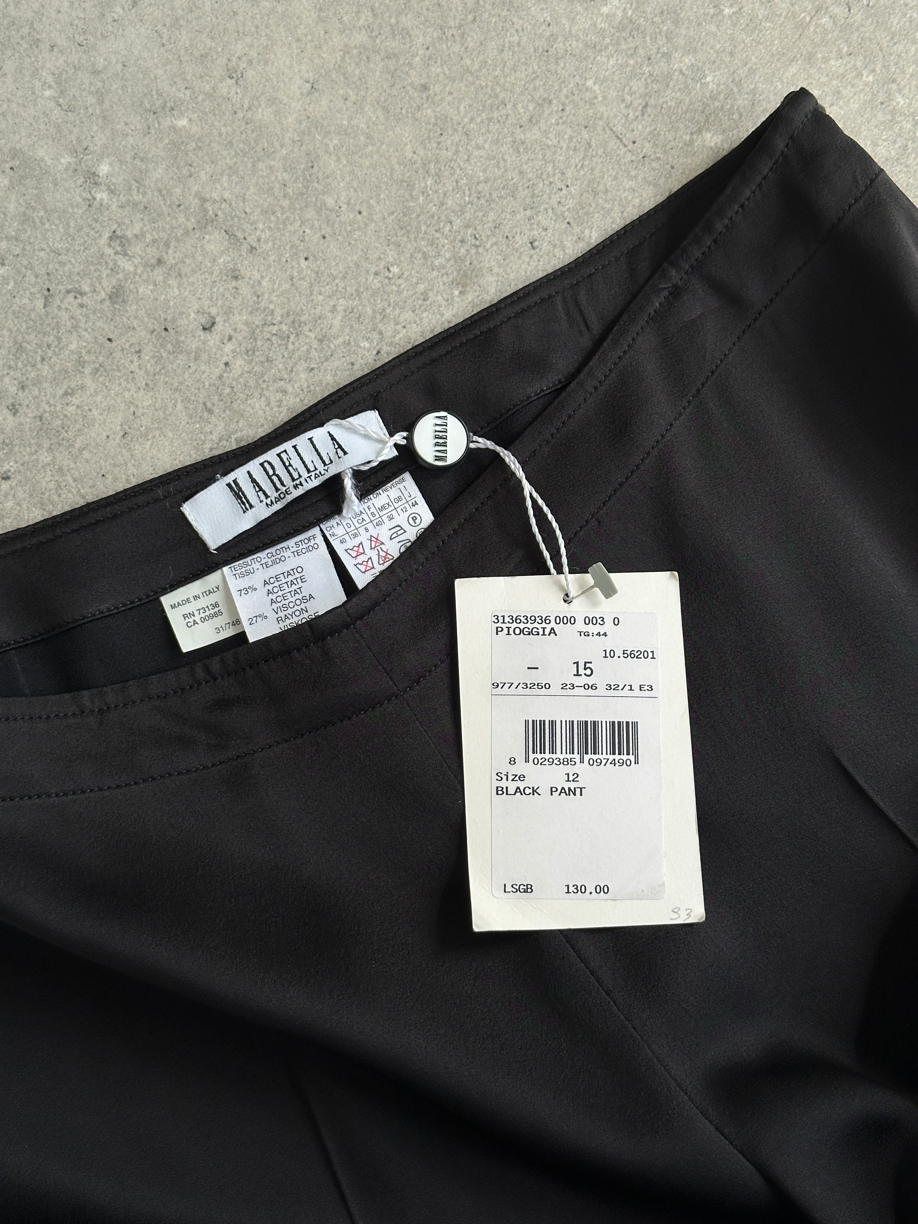 Marella 2000s loose straight-leg trousers in size W30, beige fabric, showing waistband and relaxed fit.