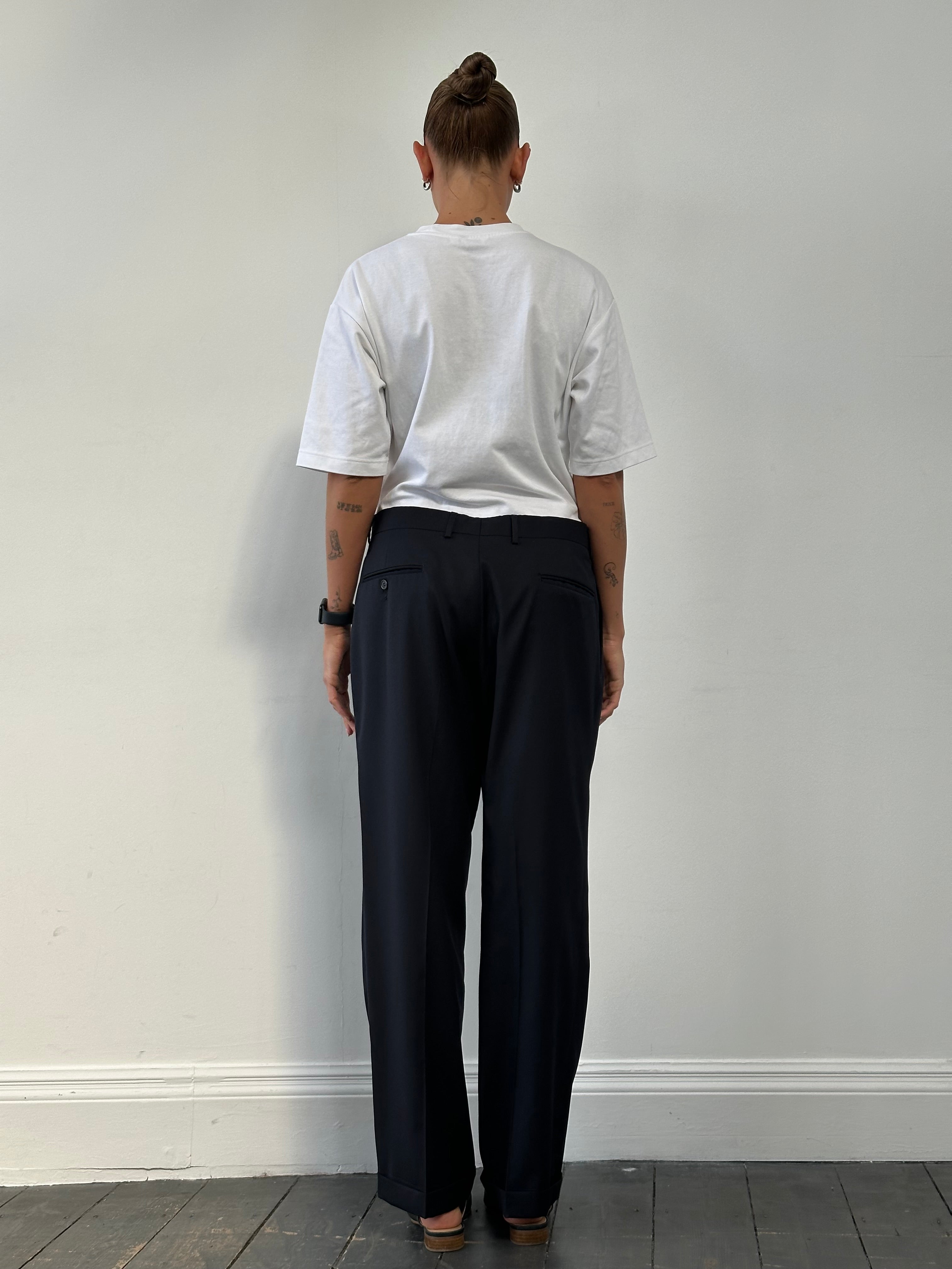 Vintage pure wool pleated straight leg tailored trousers in size W32, featuring classic design and structured fit.