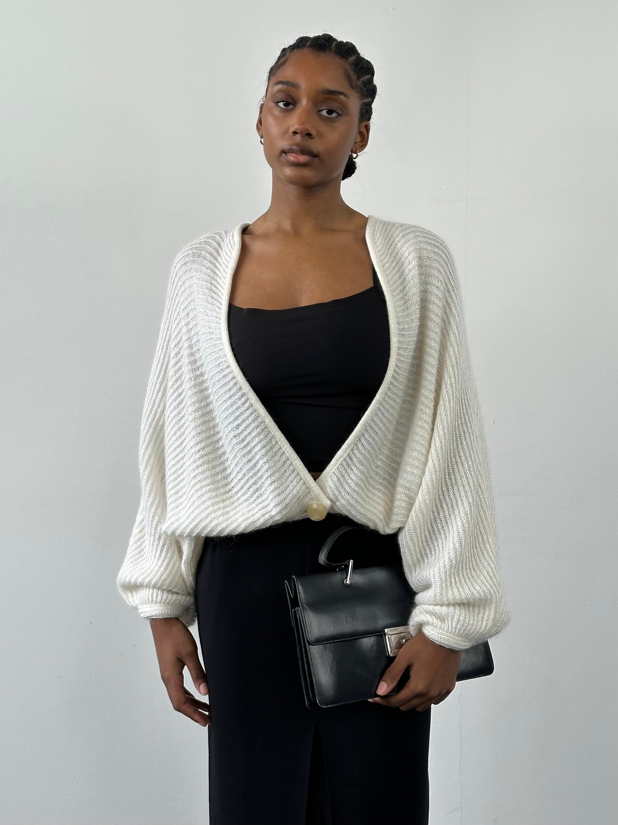 Vintage Italian 1990s mohair knitted cardigan in size M, featuring classic design and soft textured fabric.