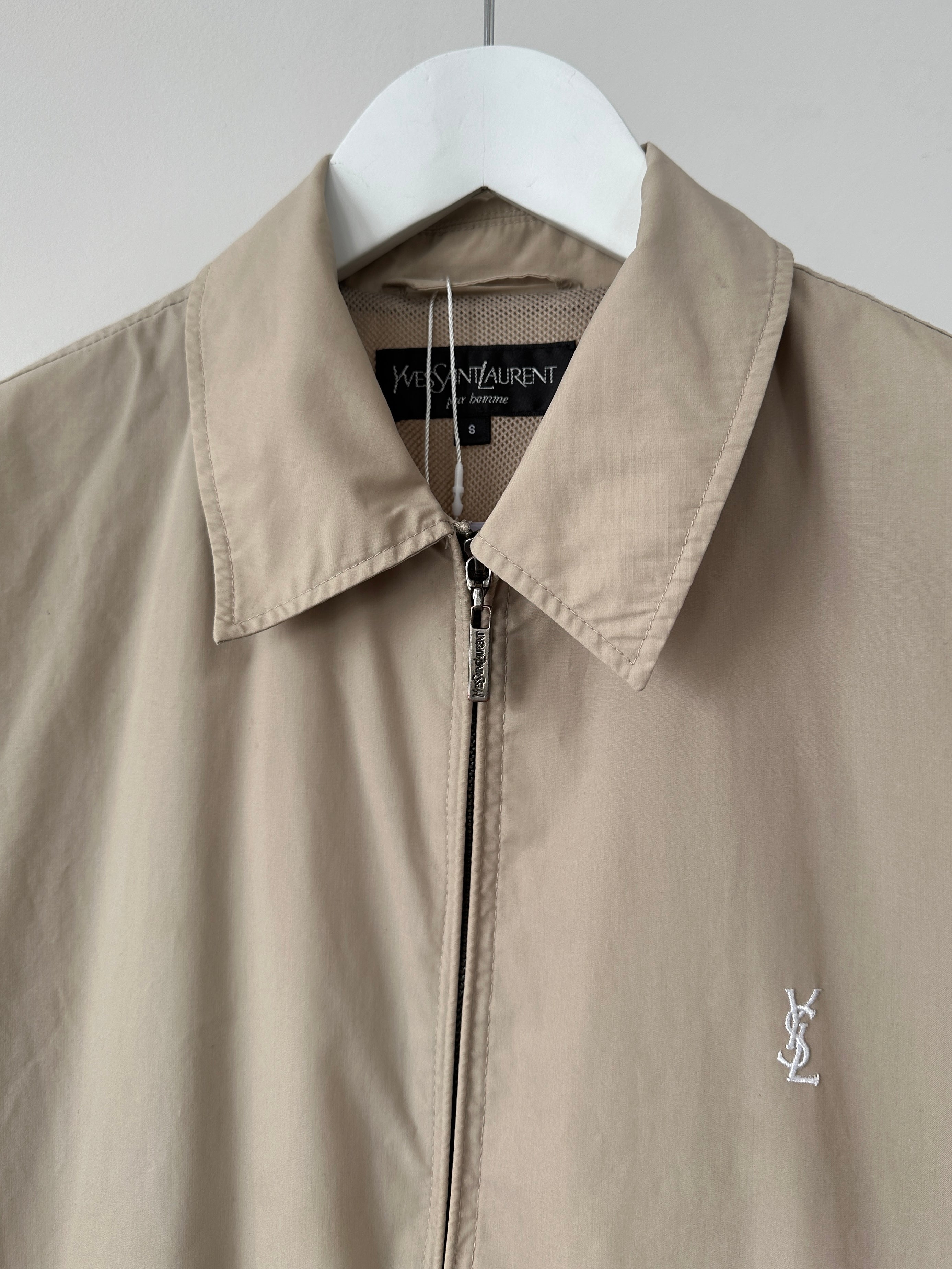 Yves Saint Laurent Pour Homme cotton logo bomber jacket in black, featuring front zipper and ribbed cuffs and hem.