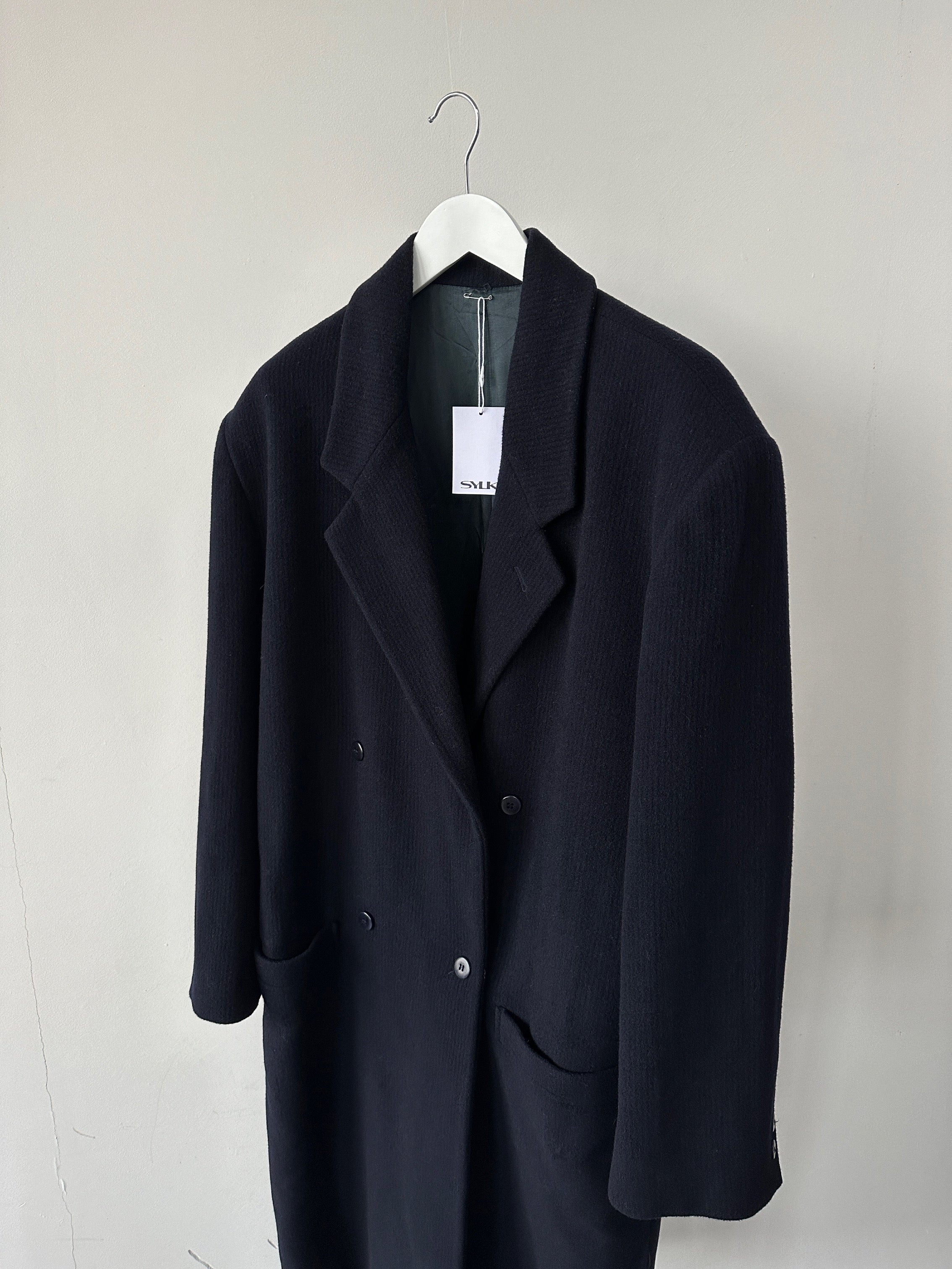 Versace wool cashmere double-breasted coat in XL, stylish coat with classic design and luxurious fabric, displayed on a hanger.