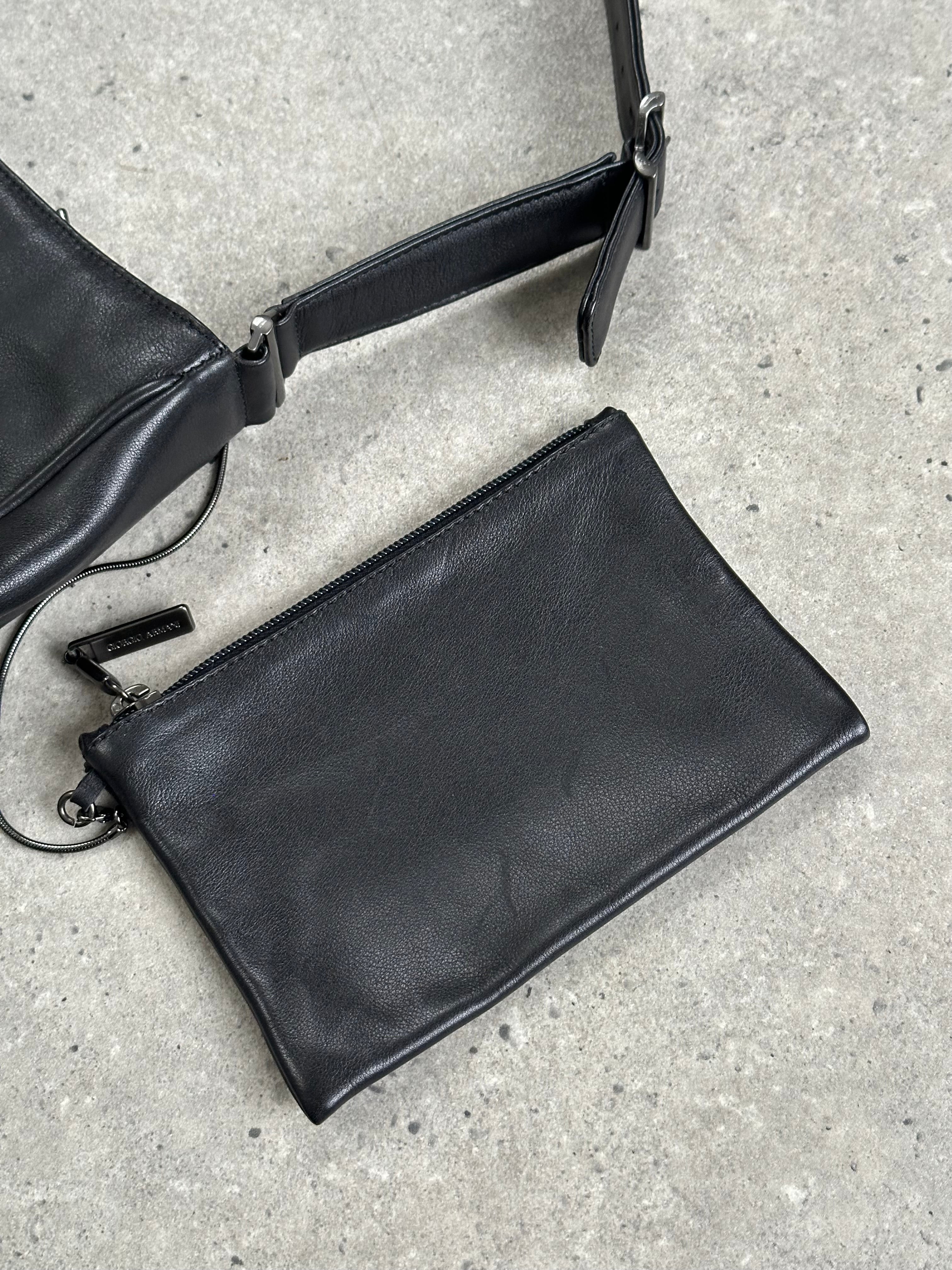 Giorgio Armani 2000s leather shoulder bag with adjustable strap and classic design, featuring smooth leather finish.