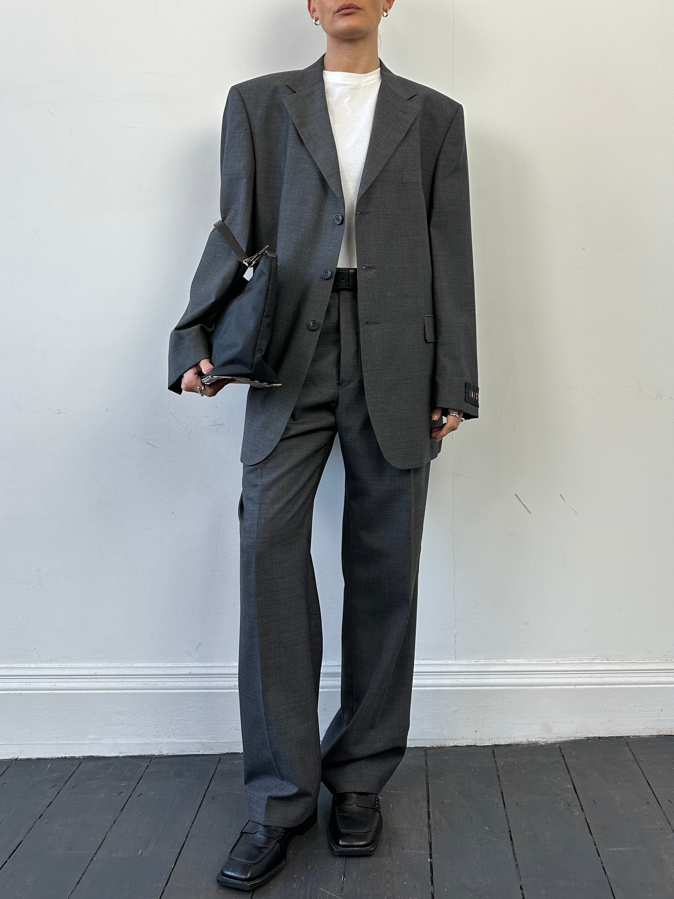 Vintage pure wool single-breasted jumpsuit in size 44R/W36, classic tailored design with lapel collar and front buttons.