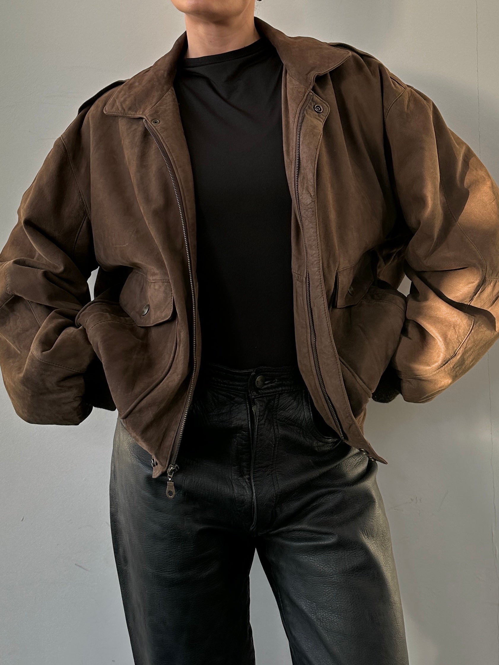 Vintage brand vintage nubuck leather bomber jacket in size large, showcasing classic collar and zip front design.