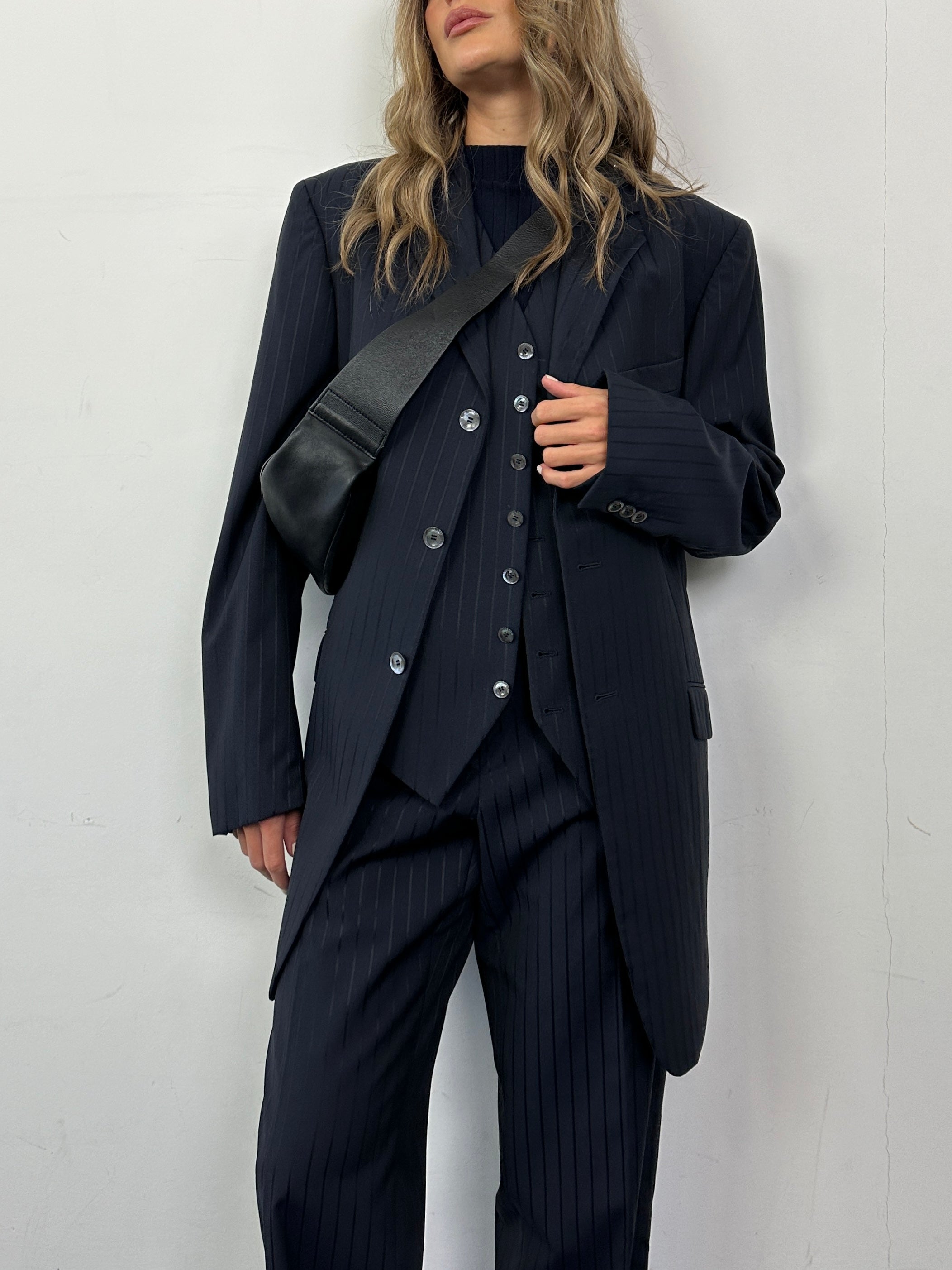 Pal Zileri pinstripe virgin wool three-piece suit in size 44R/W34, featuring a tailored blazer, vest, and matching trousers.