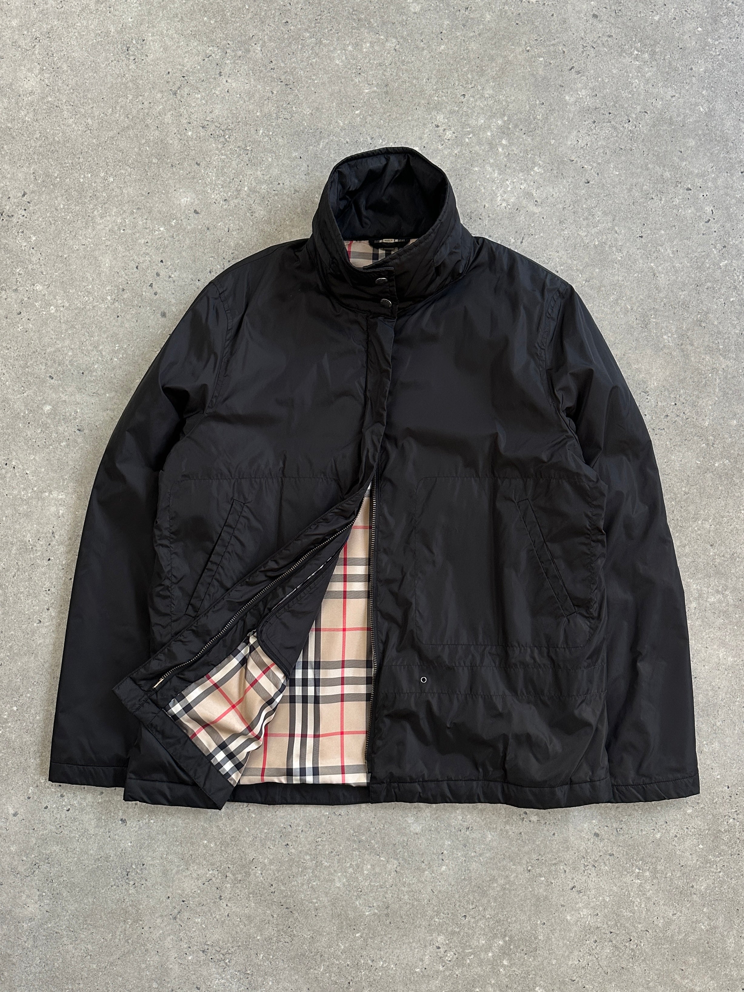 Burberry London 2000s nylon high neck jacket in size L, featuring a sleek design and high collar, displayed on a hanger.