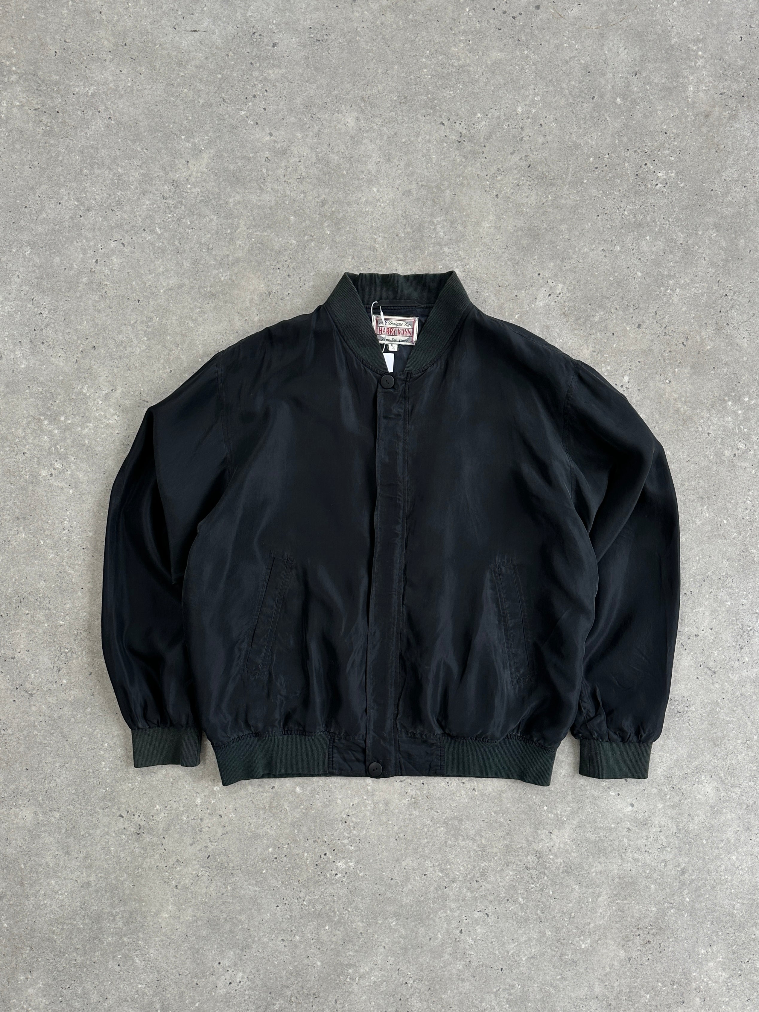 Vintage pure silk bomber jacket in size XL, featuring a classic design with a smooth silk finish and ribbed collar.