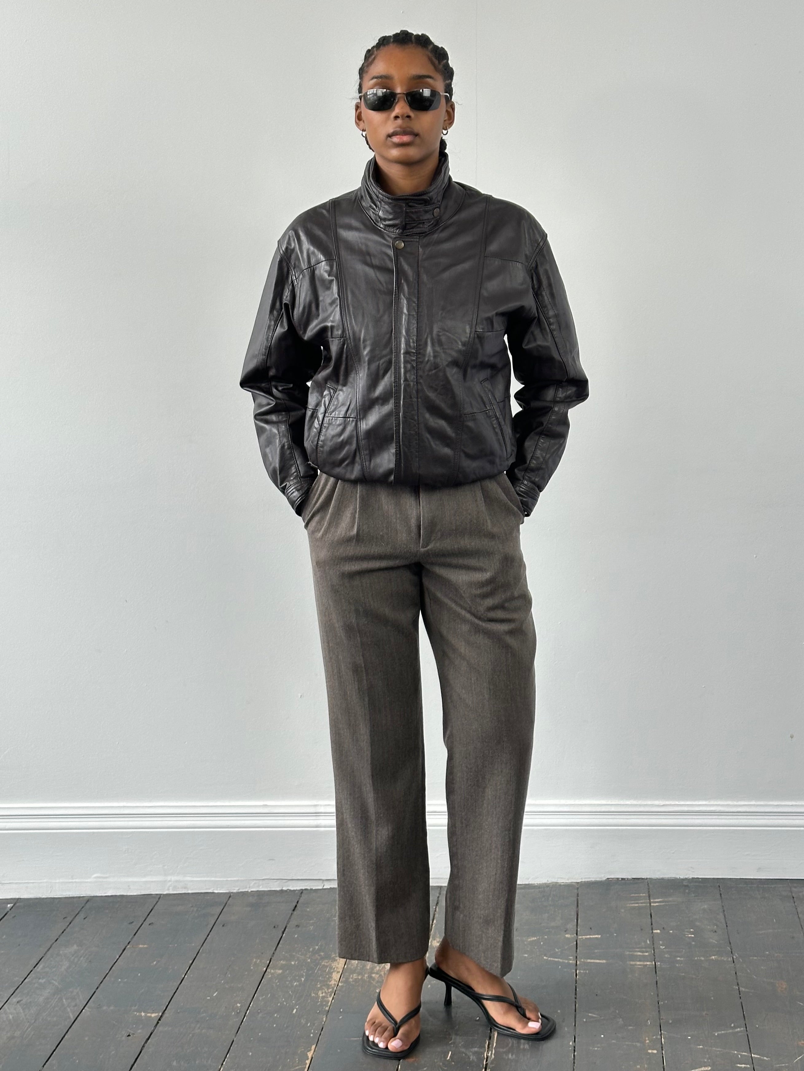 Valentino 1990s high neck leather bomber jacket in black, featuring a sleek design and tailored fit, size small.