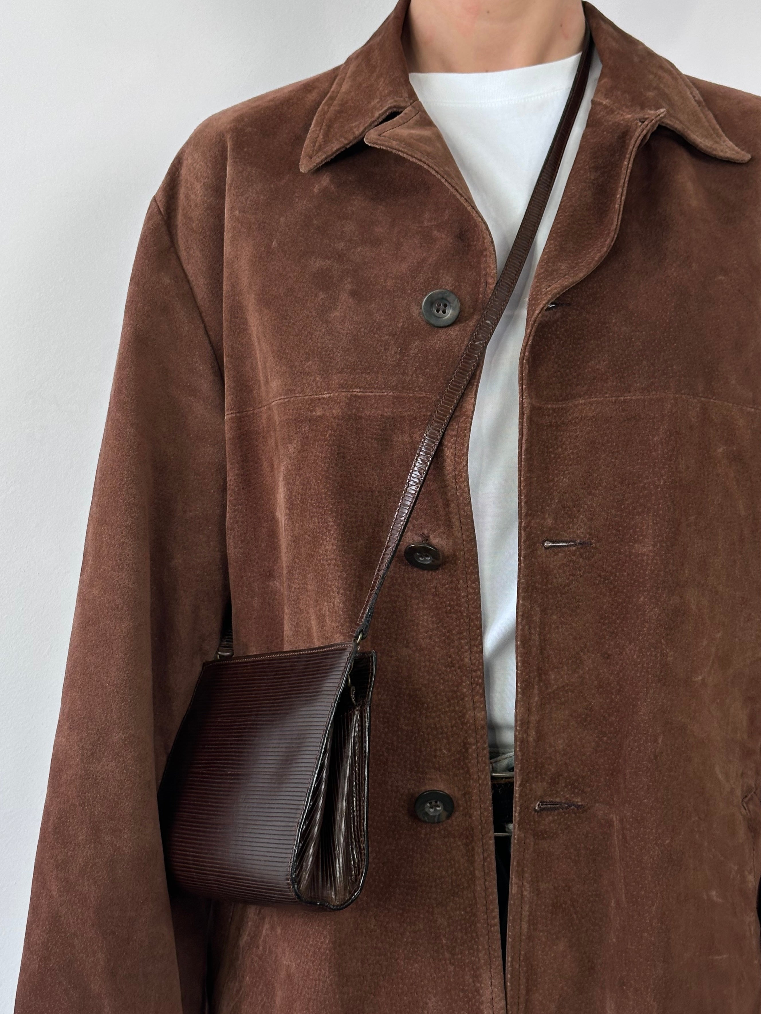 Vintage leather suede jacket in XL size, featuring classic design and soft textured material, displayed on a hanger.