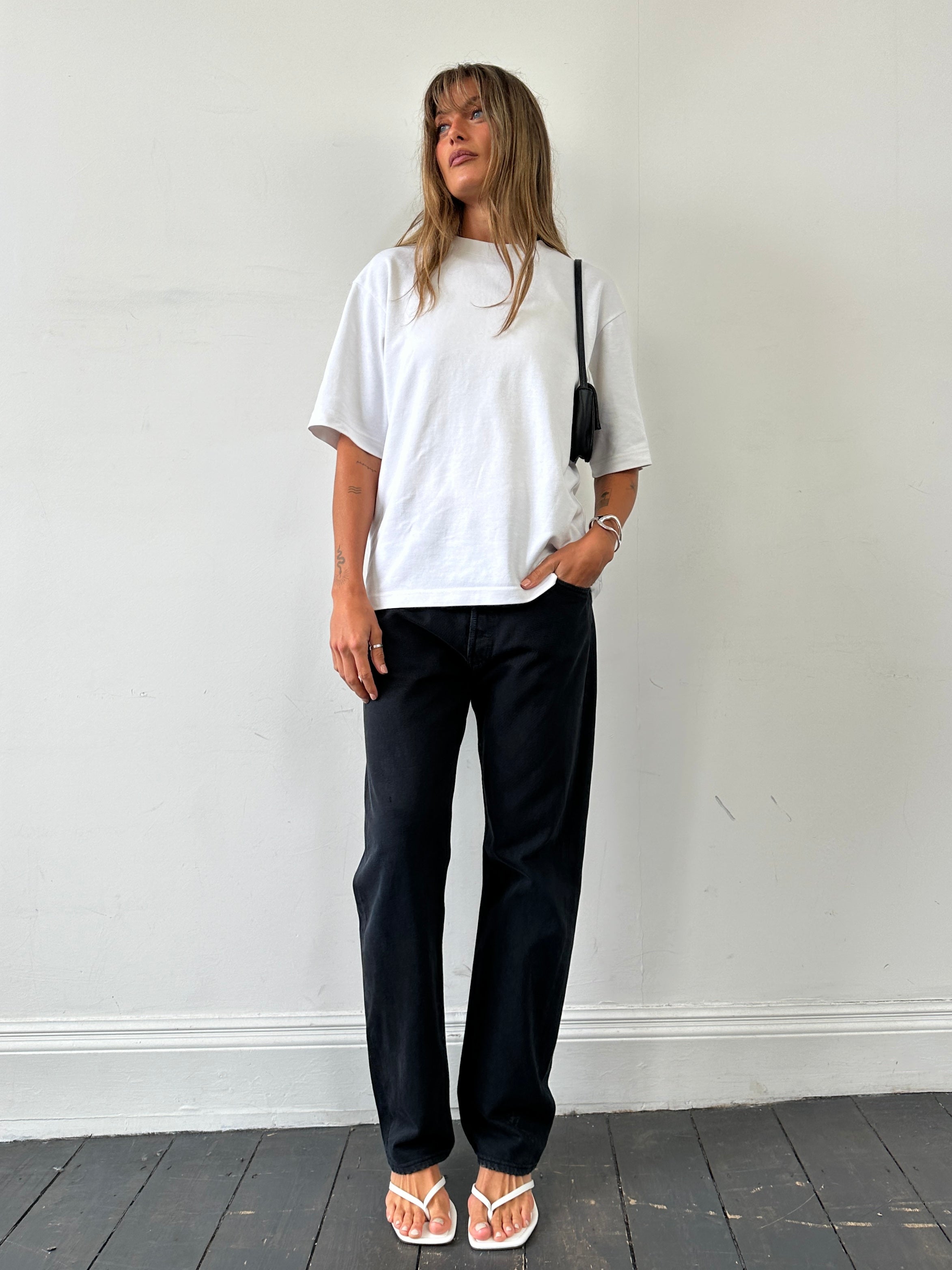 Levi’s 501 high-waisted straight-leg denim jeans in W32 waist, classic blue wash, front view showing fit and style.