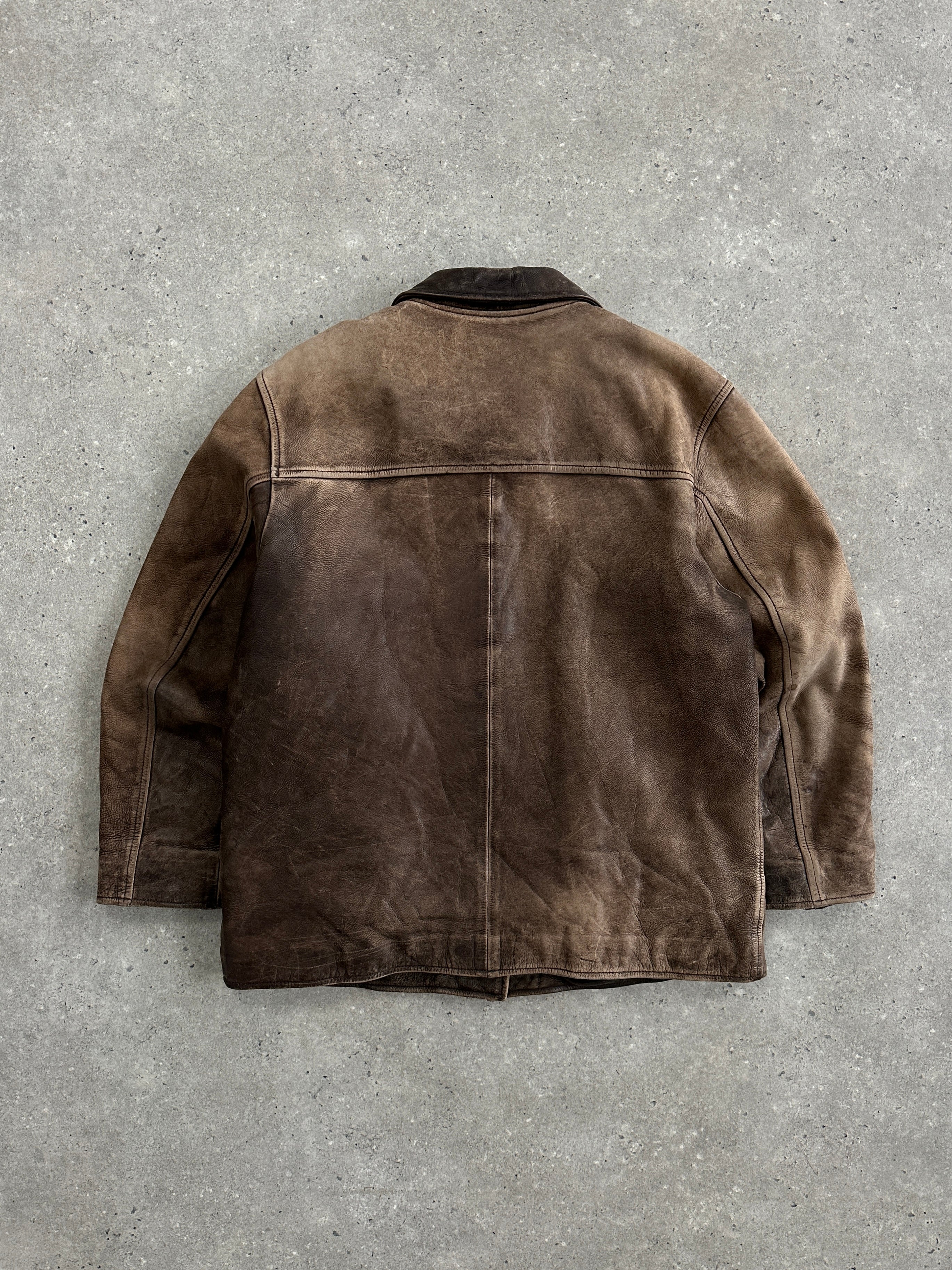 Vintage 1990s distressed leather jacket in size M, showcasing rugged texture and classic style.