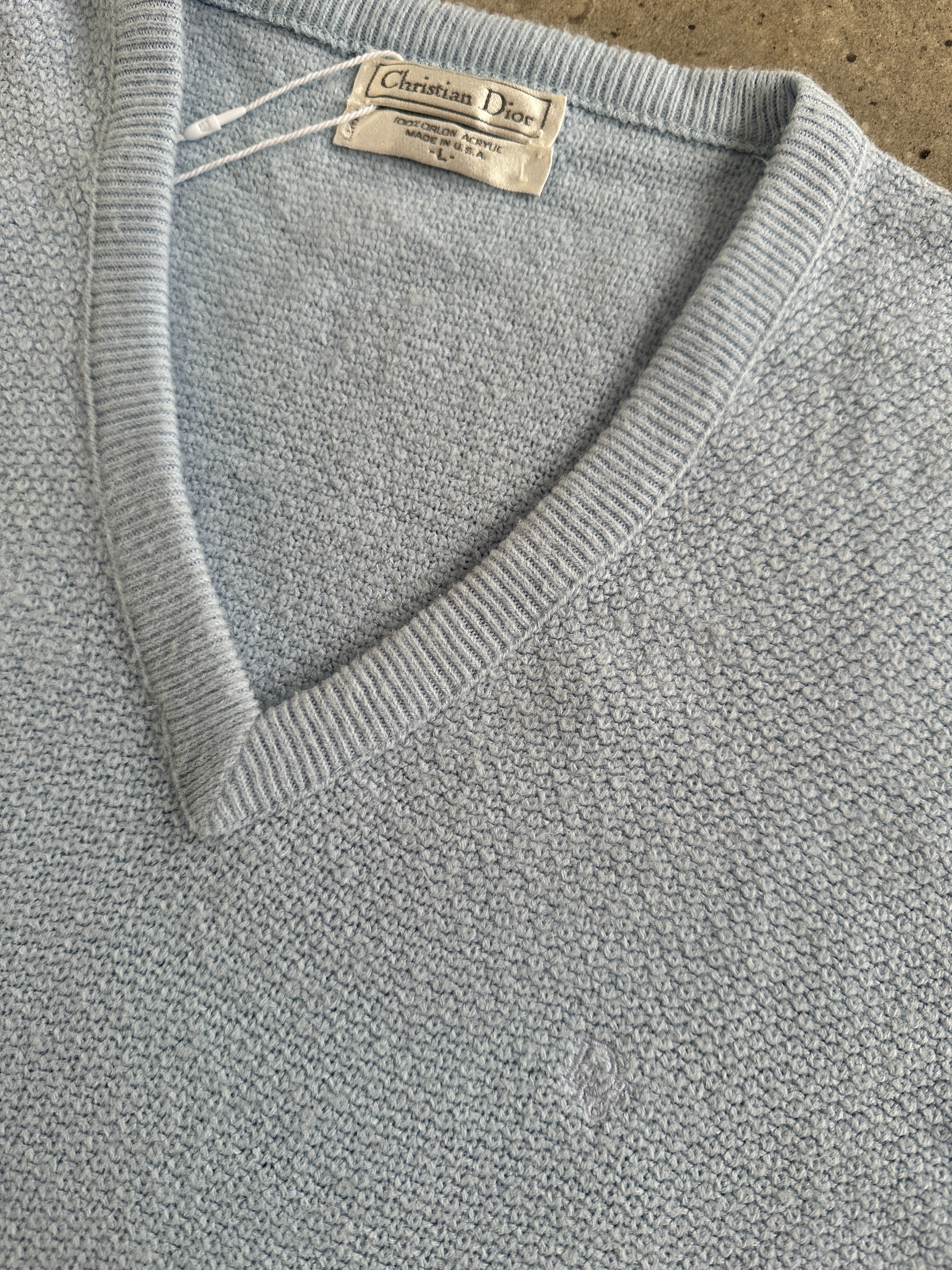 Christian Dior 1980s V-neck logo knitted jumper in size L, featuring the iconic Dior logo on a classic knit fabric.