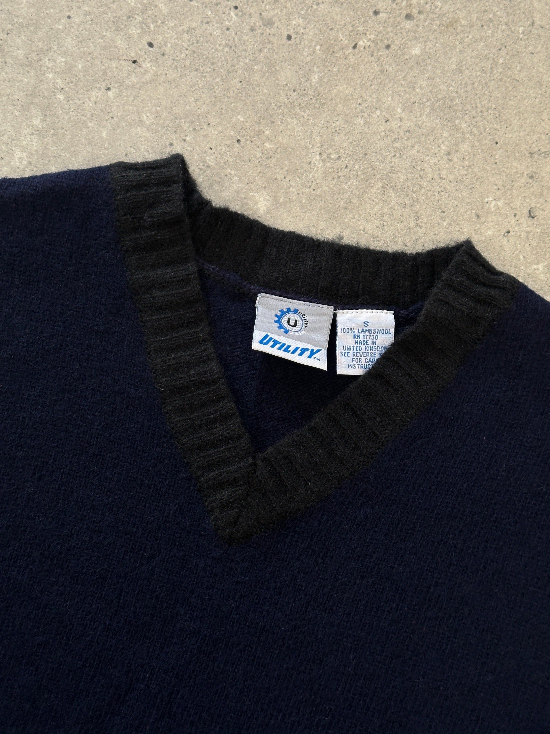 Vintage pure lambswool V-neck sleeveless vest jumper in size M, showcasing a classic, cozy knit design.