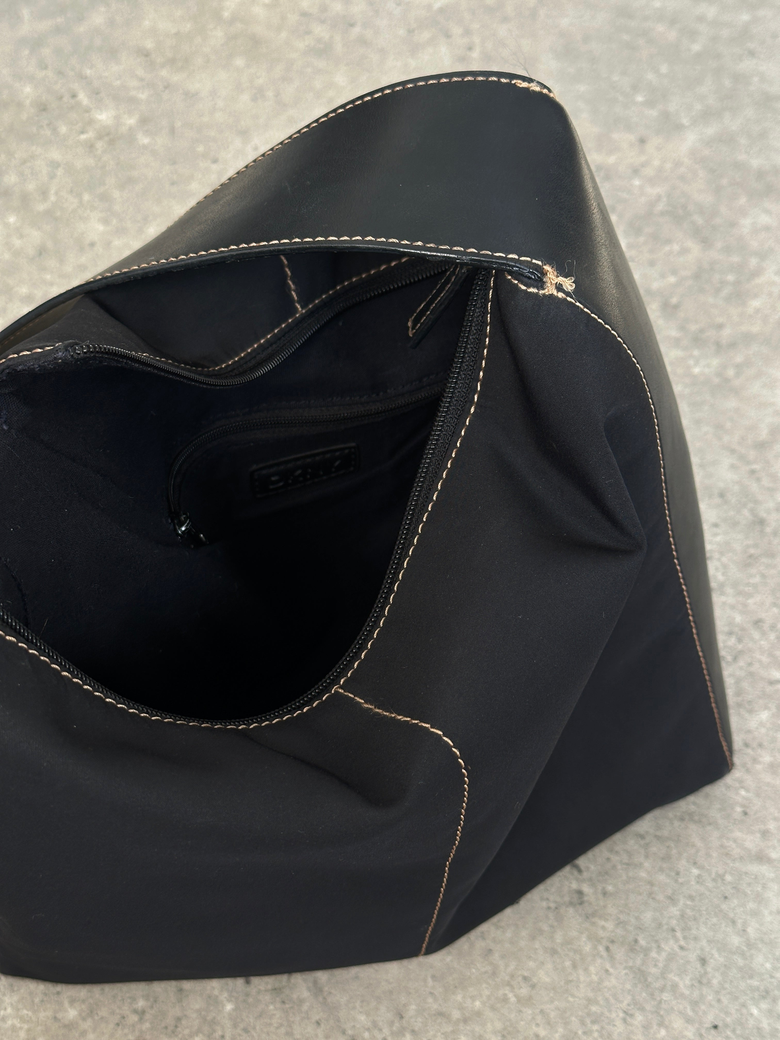 Donna Karan DKNY 2000s contrast stitch shoulder bag with sleek design and detailed stitching, stylish accessory for everyday use.