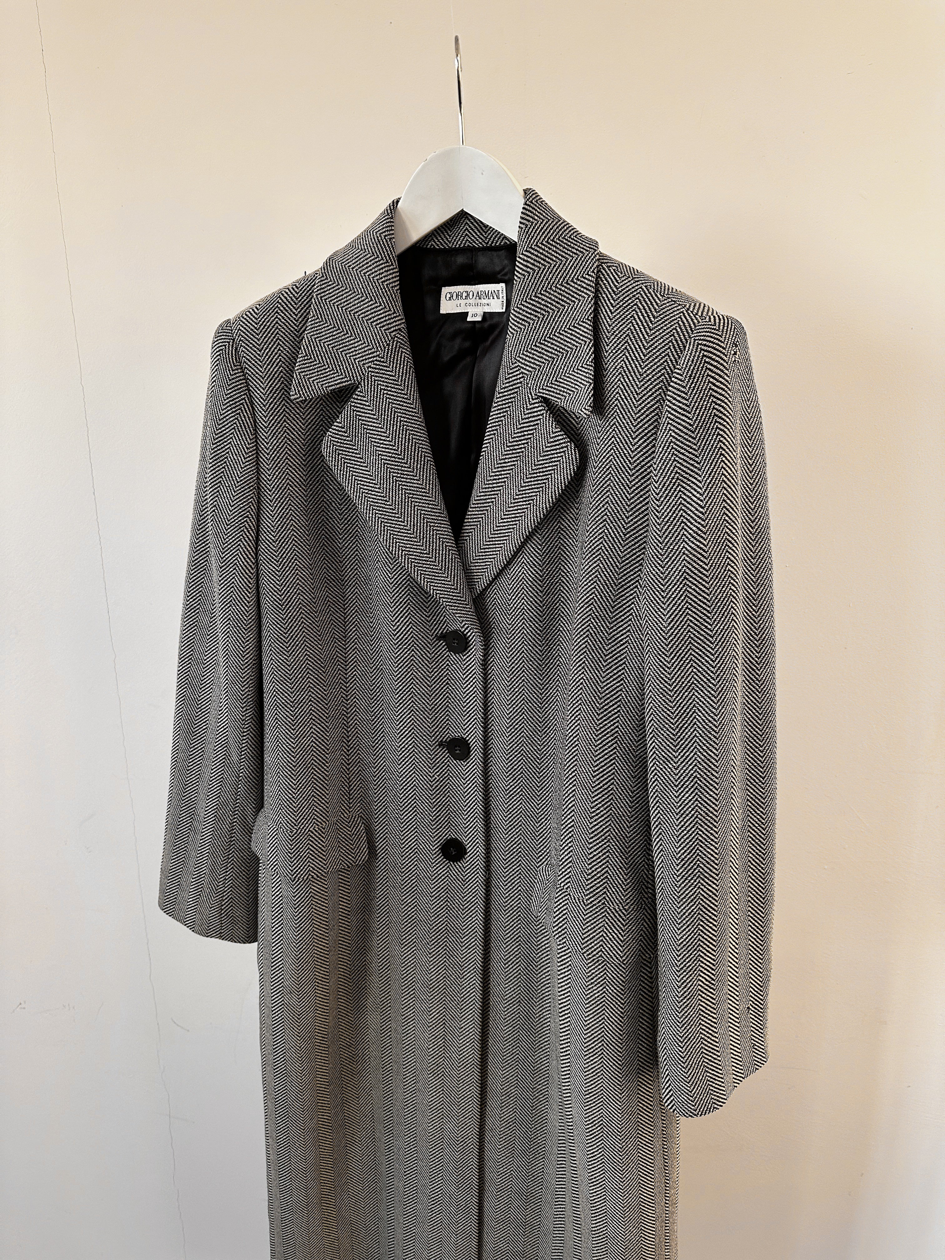 Giorgio Armani Le Collezioni virgin wool herringbone coat in size M, featuring a classic tailored design and herringbone pattern.