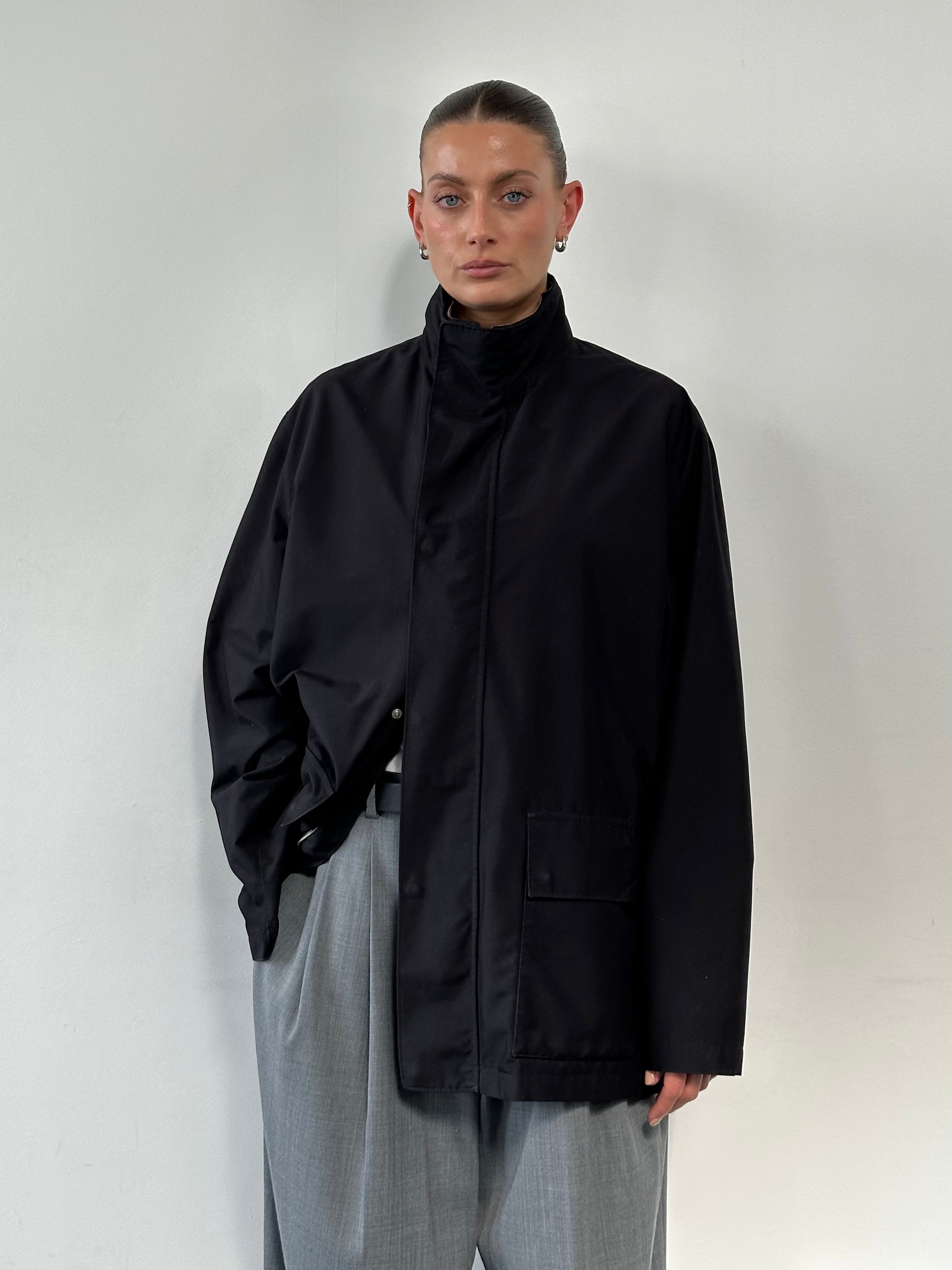 Loro Piana Storm System Traveller Jacket in XL, lightweight waterproof jacket with sleek design and adjustable hood.