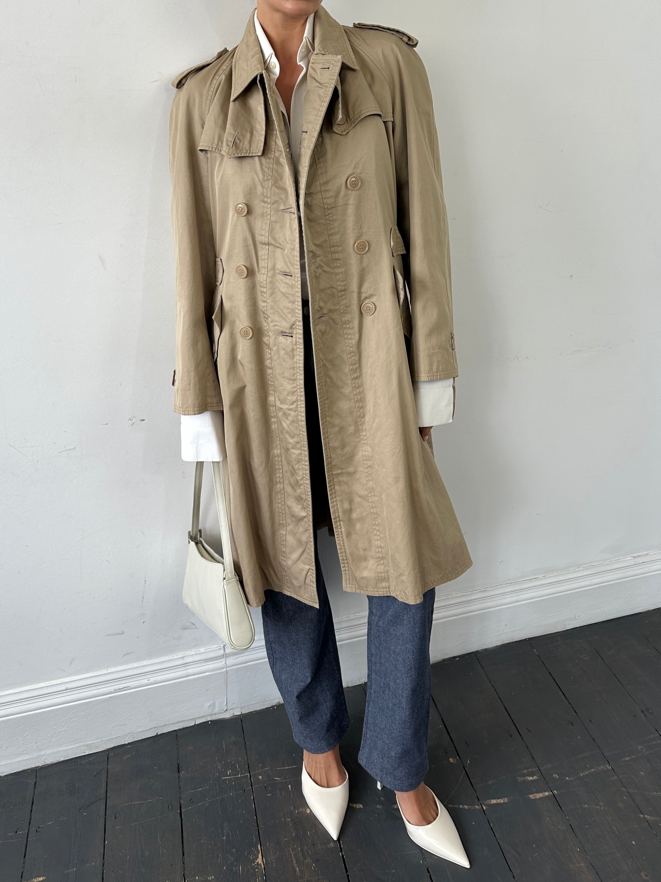 Yves Saint Laurent pure cotton double-breasted trench coat in size M, beige color, showing front view with classic collar and belted waist