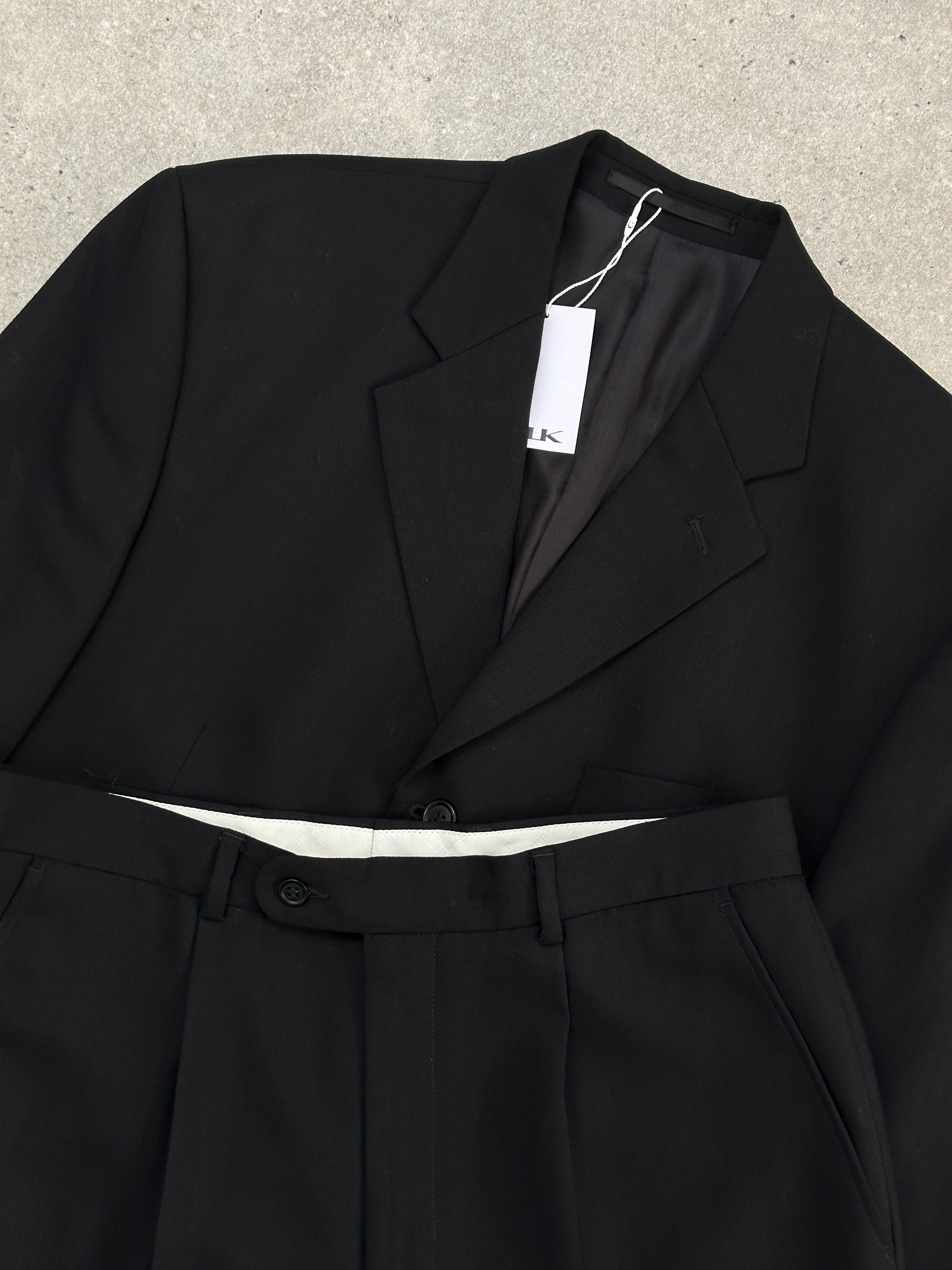 Pierre Cardin pure wool single-breasted suit jumpsuit in size 40R/W33, tailored fit with classic lapel and front buttons.