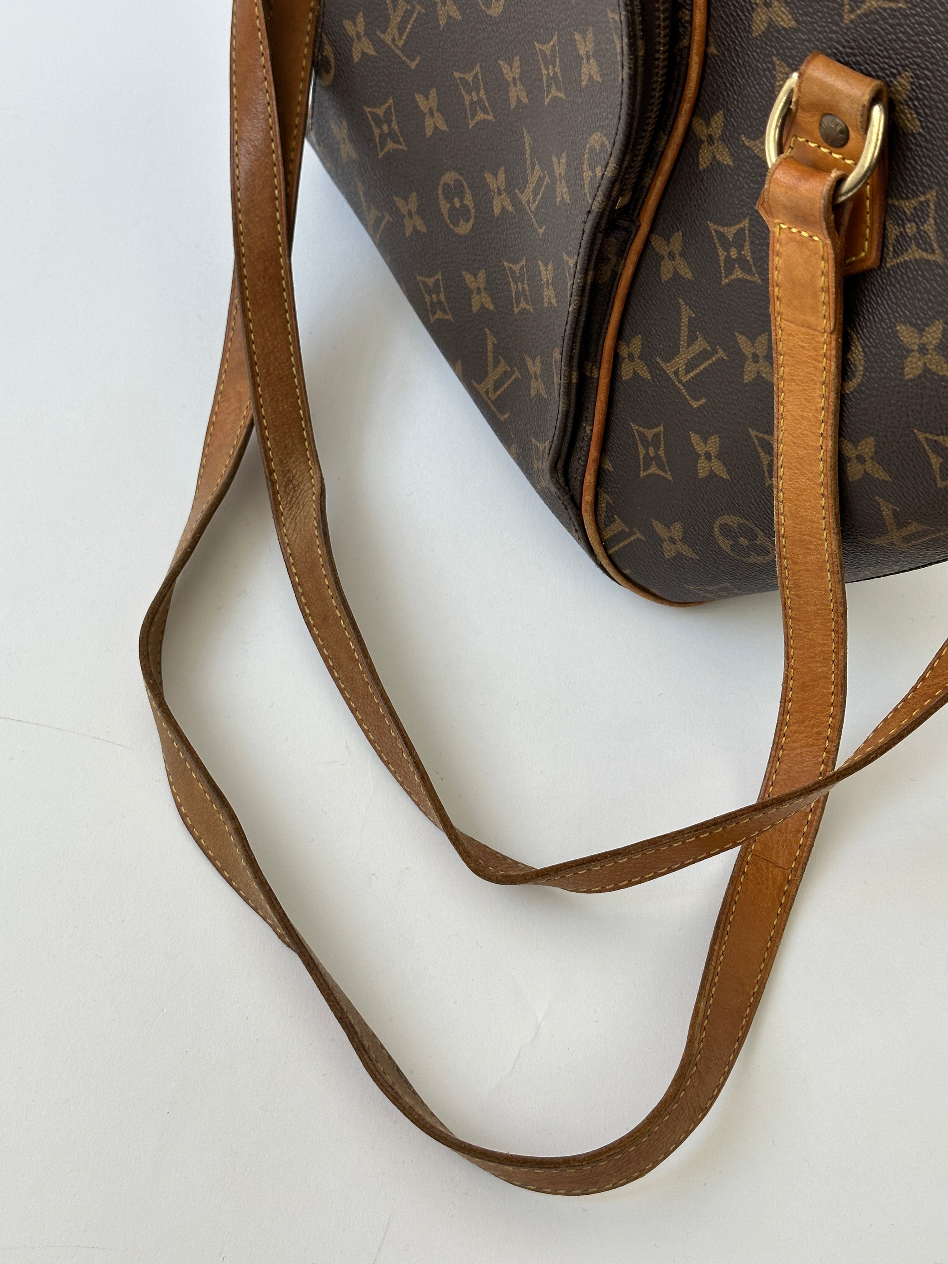 Louis Vuitton 1997 Ellipse Shoulder Bag in brown leather with gold-tone hardware and adjustable strap.