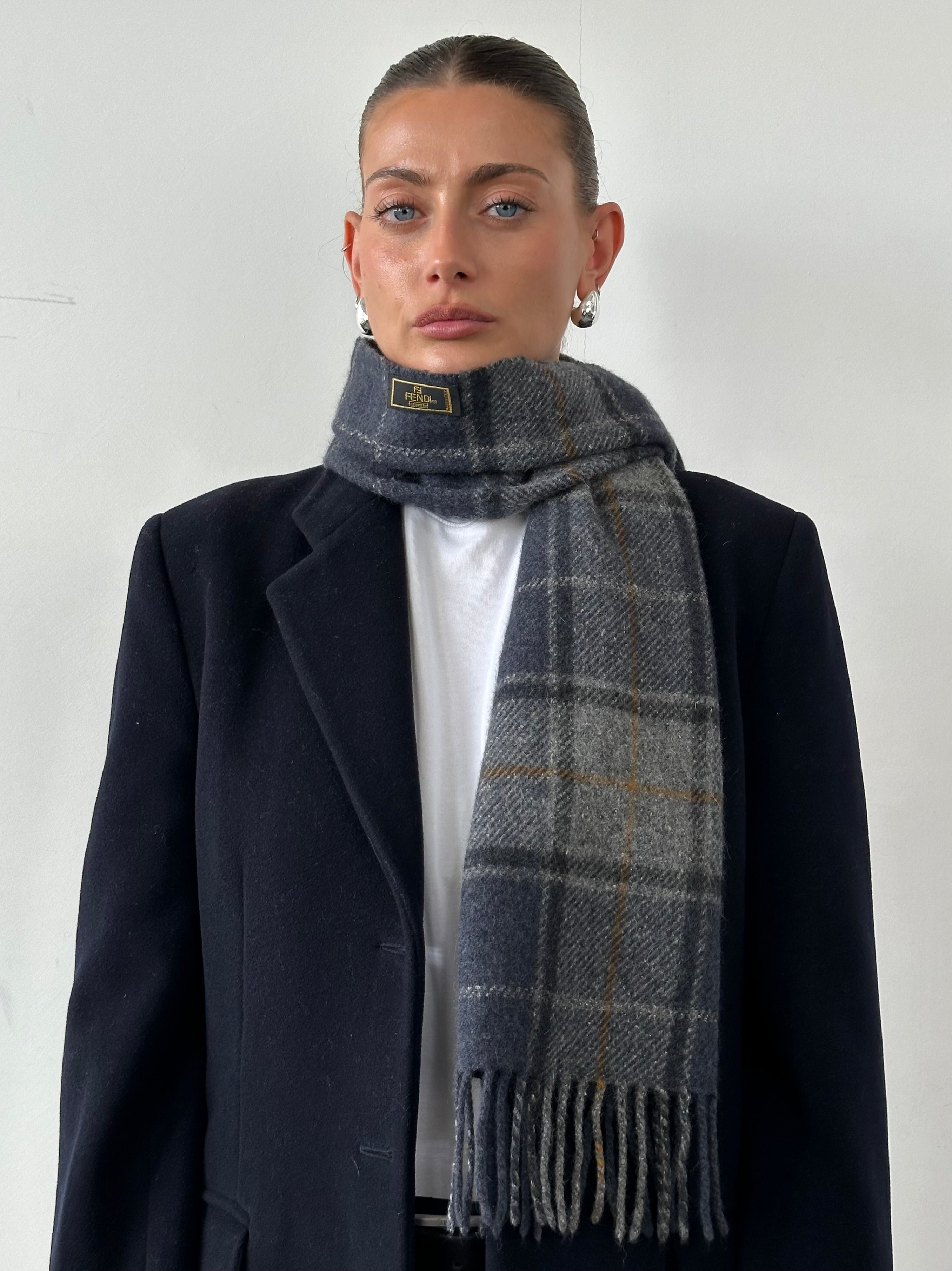 Fendi Pure Wool Logo Check Scarf featuring a classic check pattern and brand logo, perfect for adding style and warmth.