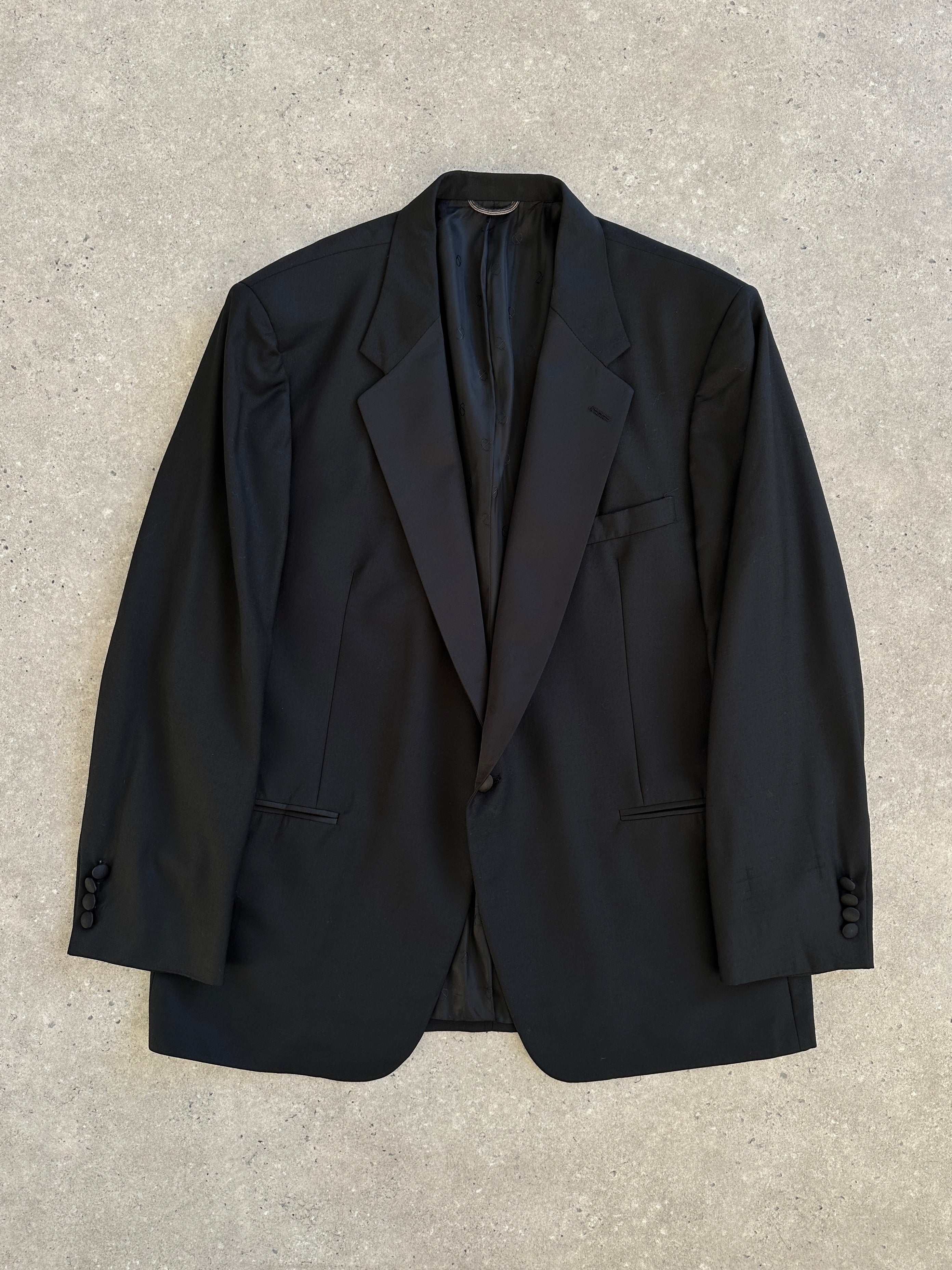 Christian Dior Monsieur 1980s wool tuxedo blazer, size 44R/XL, tailored fit, classic black with satin lapels, front button closure.