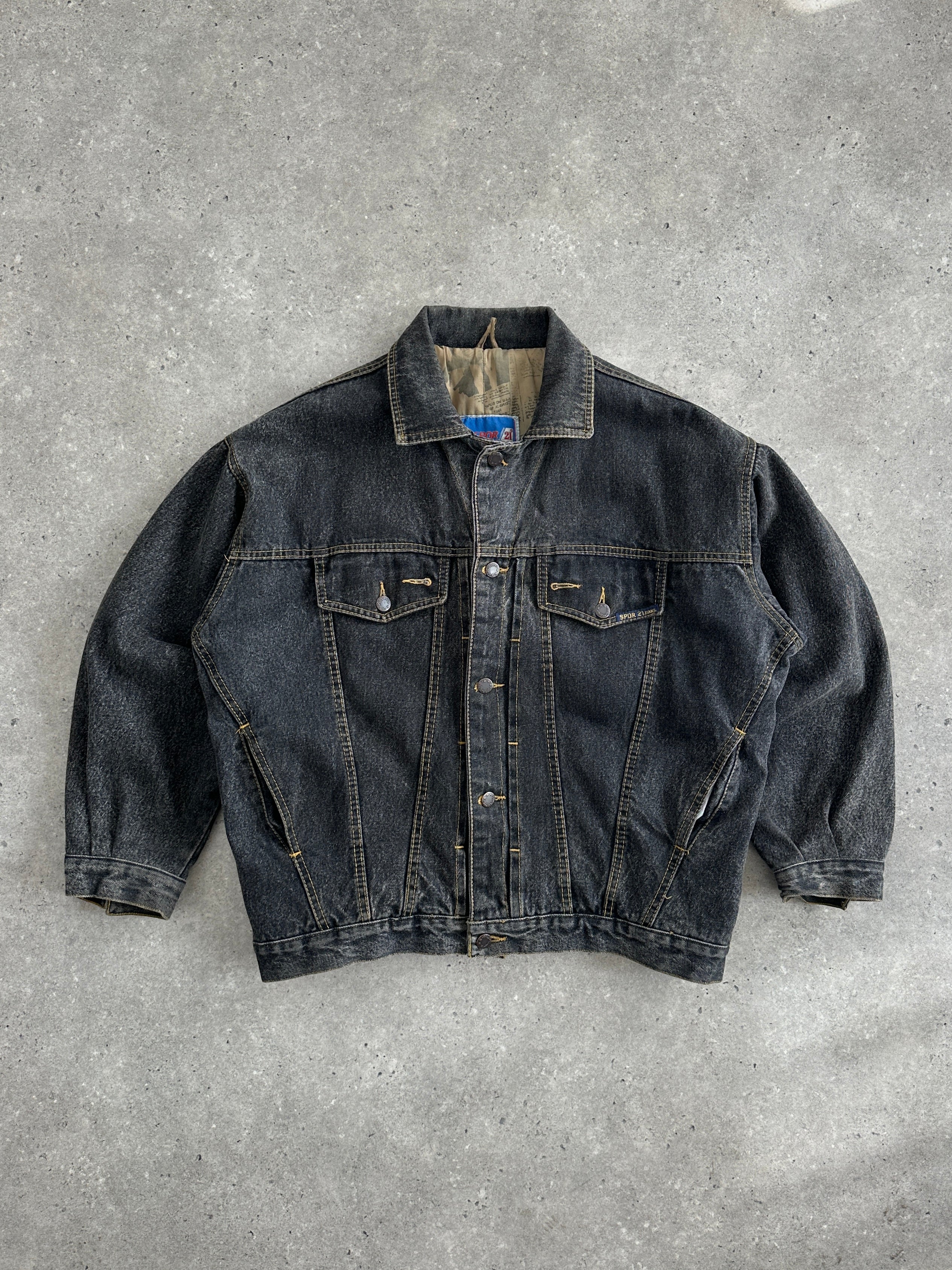 Vintage 1990s boxy denim jacket with classic fit, shown in medium size, featuring distressed details and a timeless denim design.