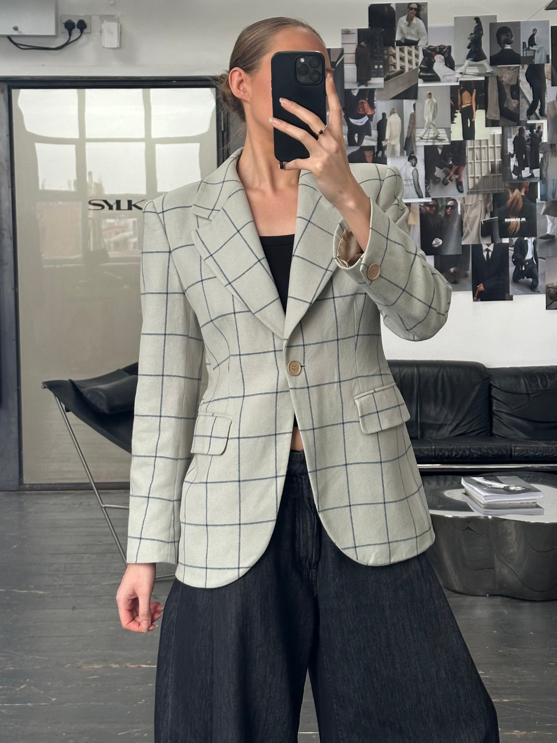 Emporio Armani 1990s wool check blazer in size M, featuring classic tailored fit and patterned fabric with lapel collar.