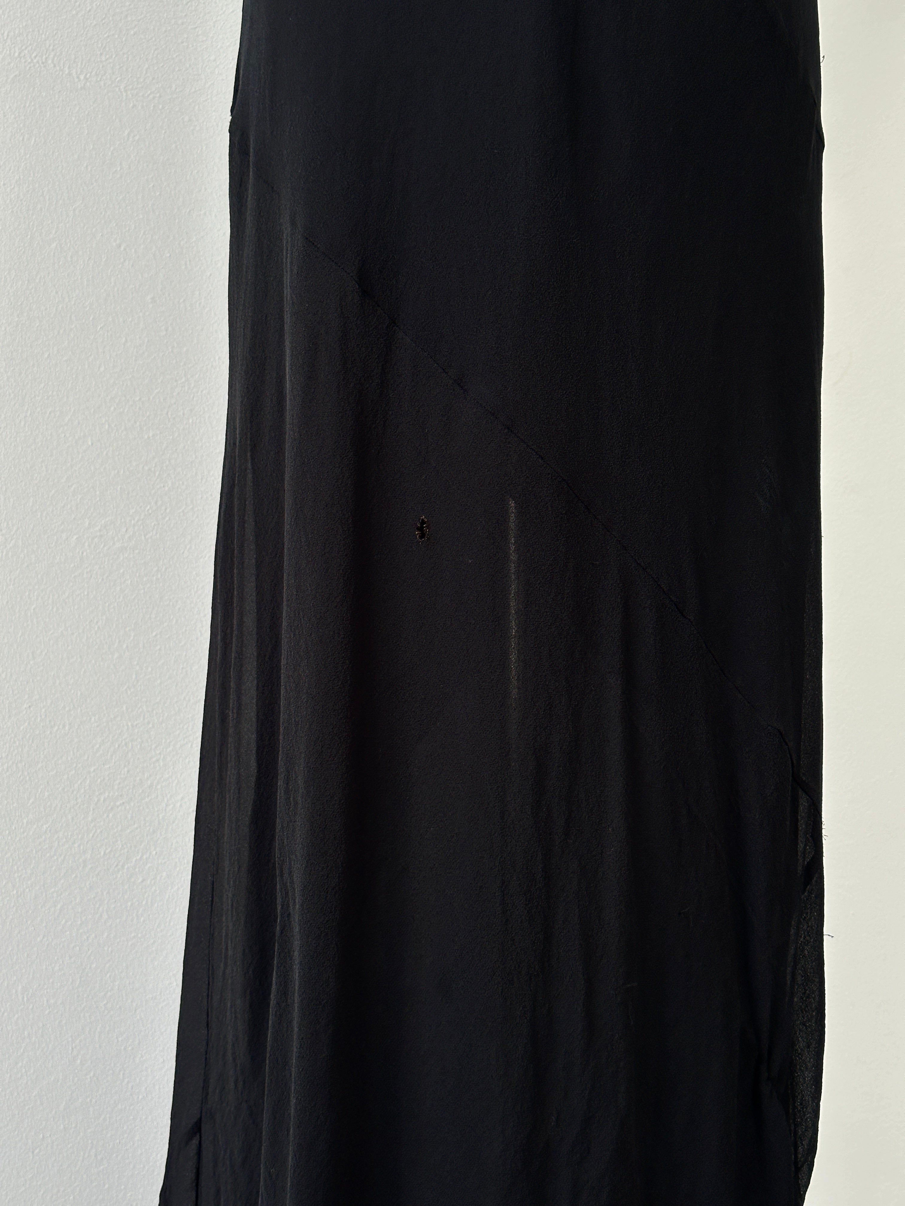 Vintage 2000s pure silk floor length dress in a natural pose, showcasing elegant fabric and classic design.