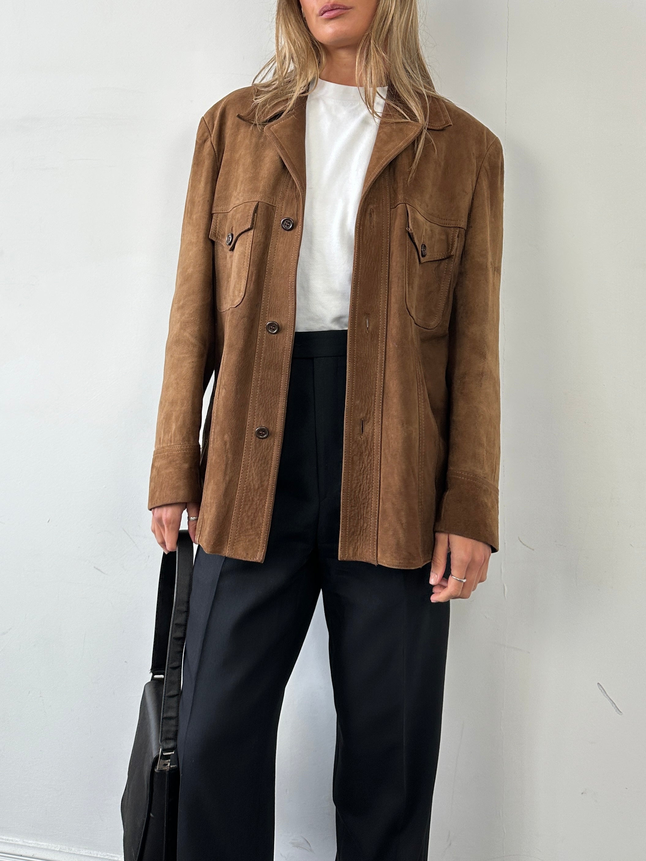 Vintage British 70s suede leather trucker jacket, size large, featuring classic retro style and authentic vintage design details.