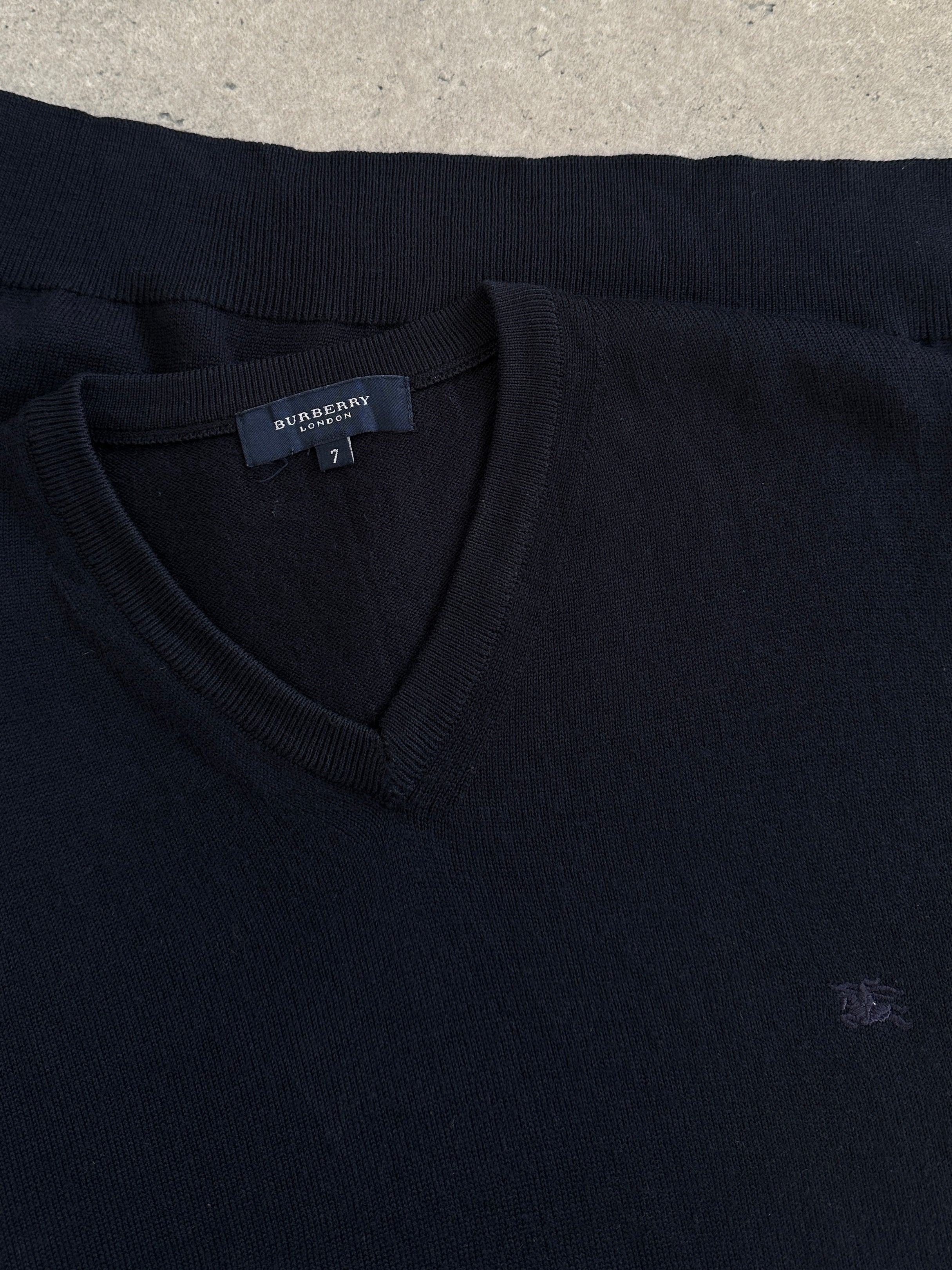 Burberry London 2000s merino wool V-neck knitted jumper in XL, featuring classic design and soft wool texture.