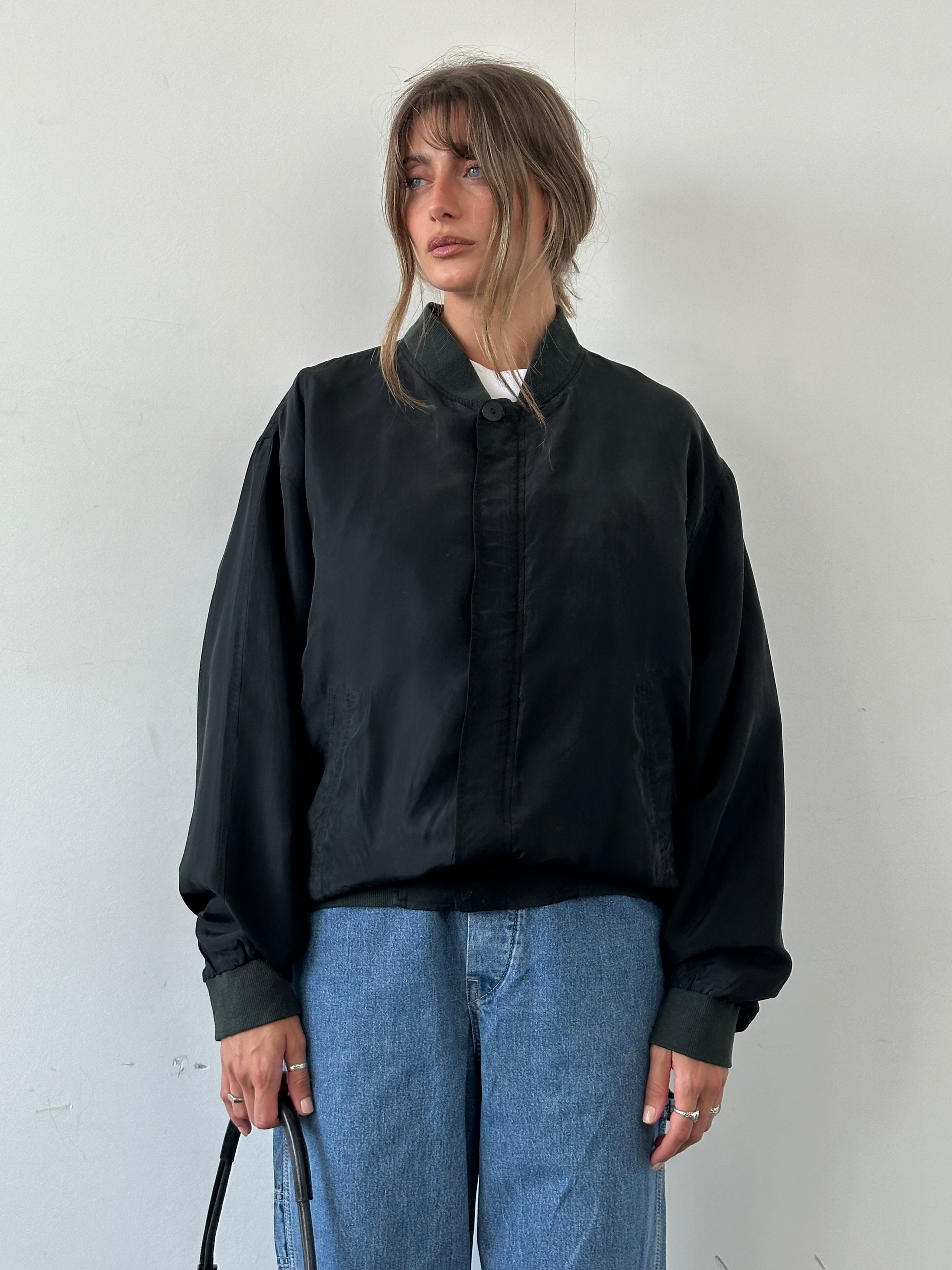 Vintage pure silk bomber jacket in XL size, featuring classic design with a smooth silk finish and vintage style.