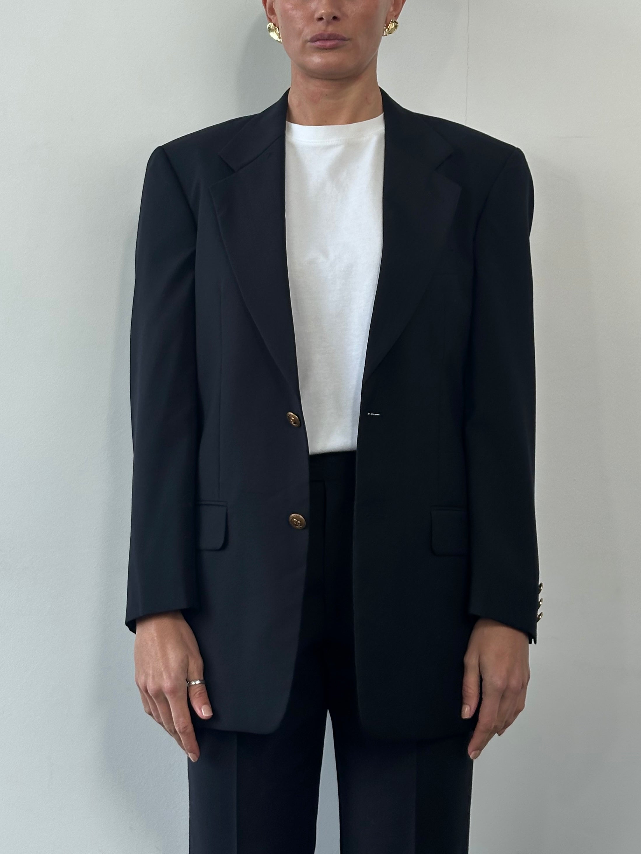 Valentino bespoke pure wool single-breasted blazer in size 36R/M, tailored fit with classic lapel and button closure.