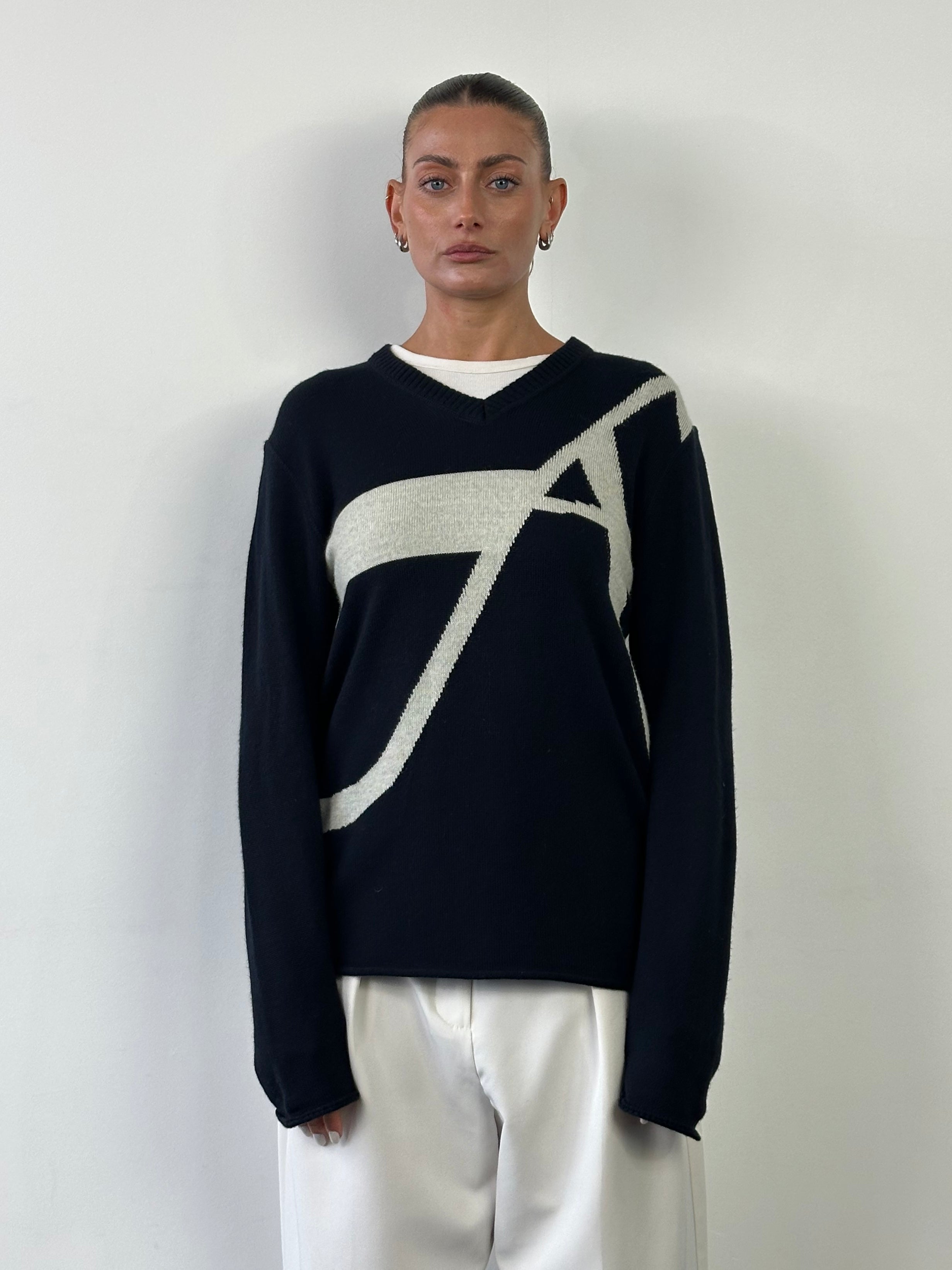 Armani Jeans men's virgin wool knitted logo jumper in navy, featuring a ribbed collar, cuffs, and embroidered logo.