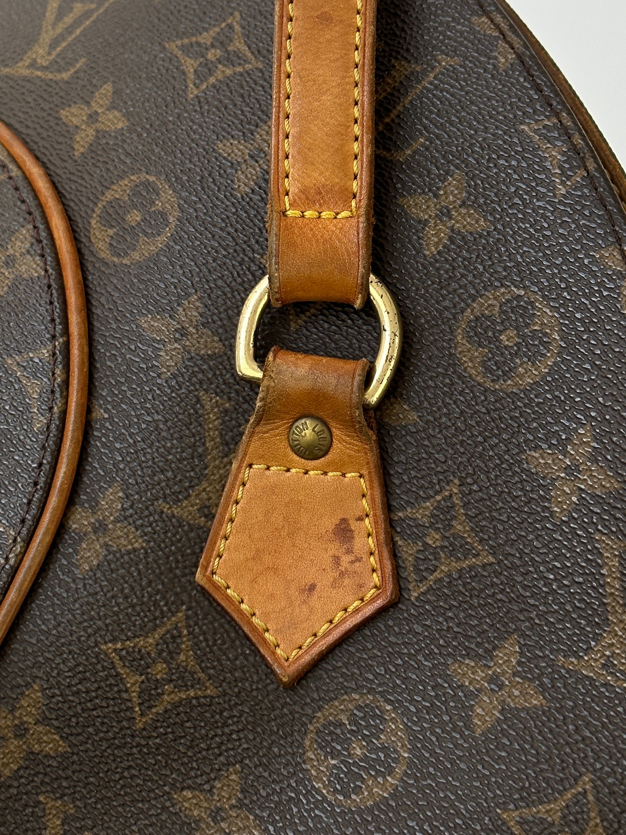 Louis Vuitton 1997 Ellipse Shoulder Bag with monogram canvas and leather strap, stylish accessory for everyday wear.