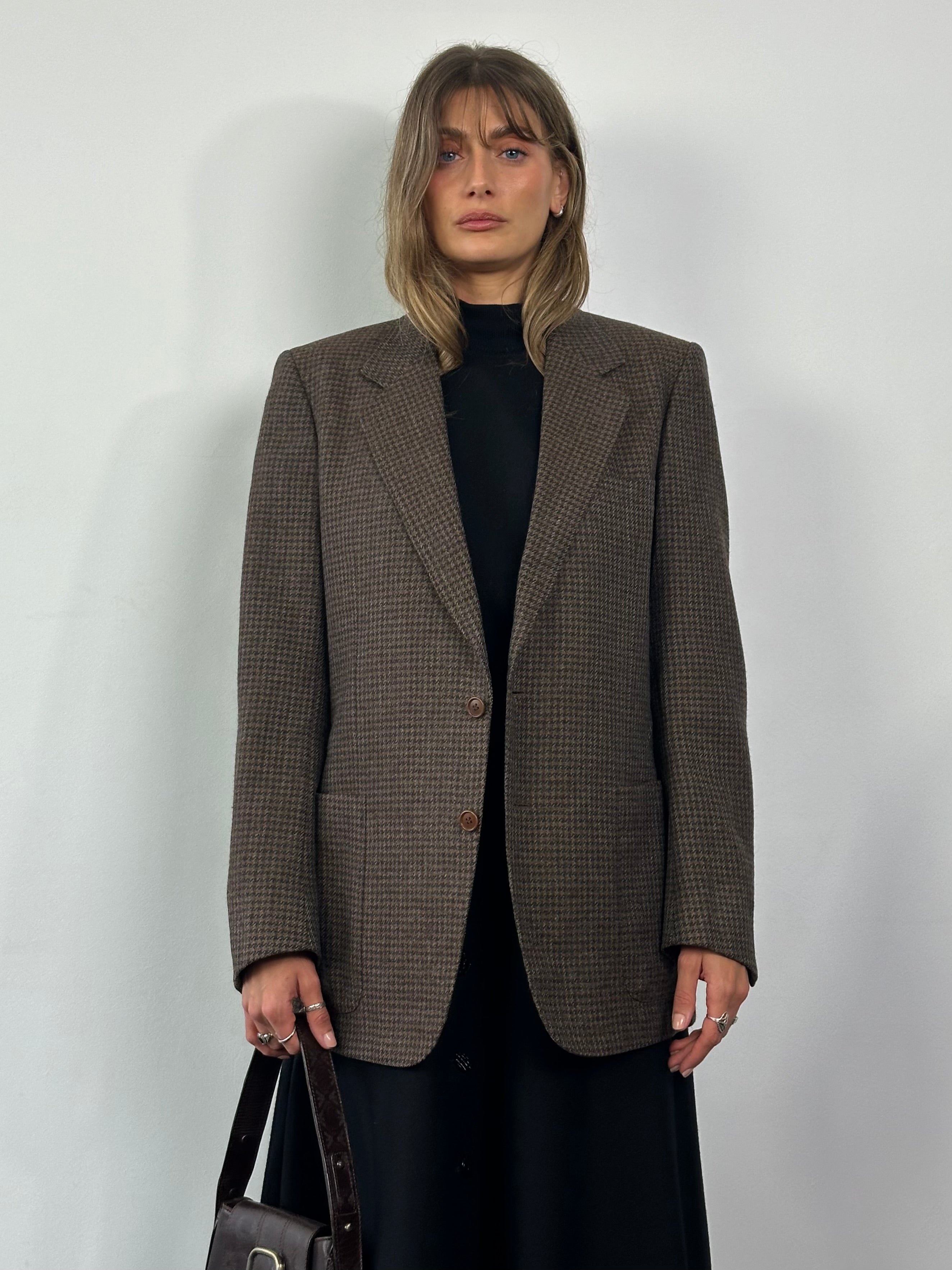 Yves Saint Laurent Circa 80s wool tweed single-breasted blazer in size L, featuring classic tailored design and textured fabric.