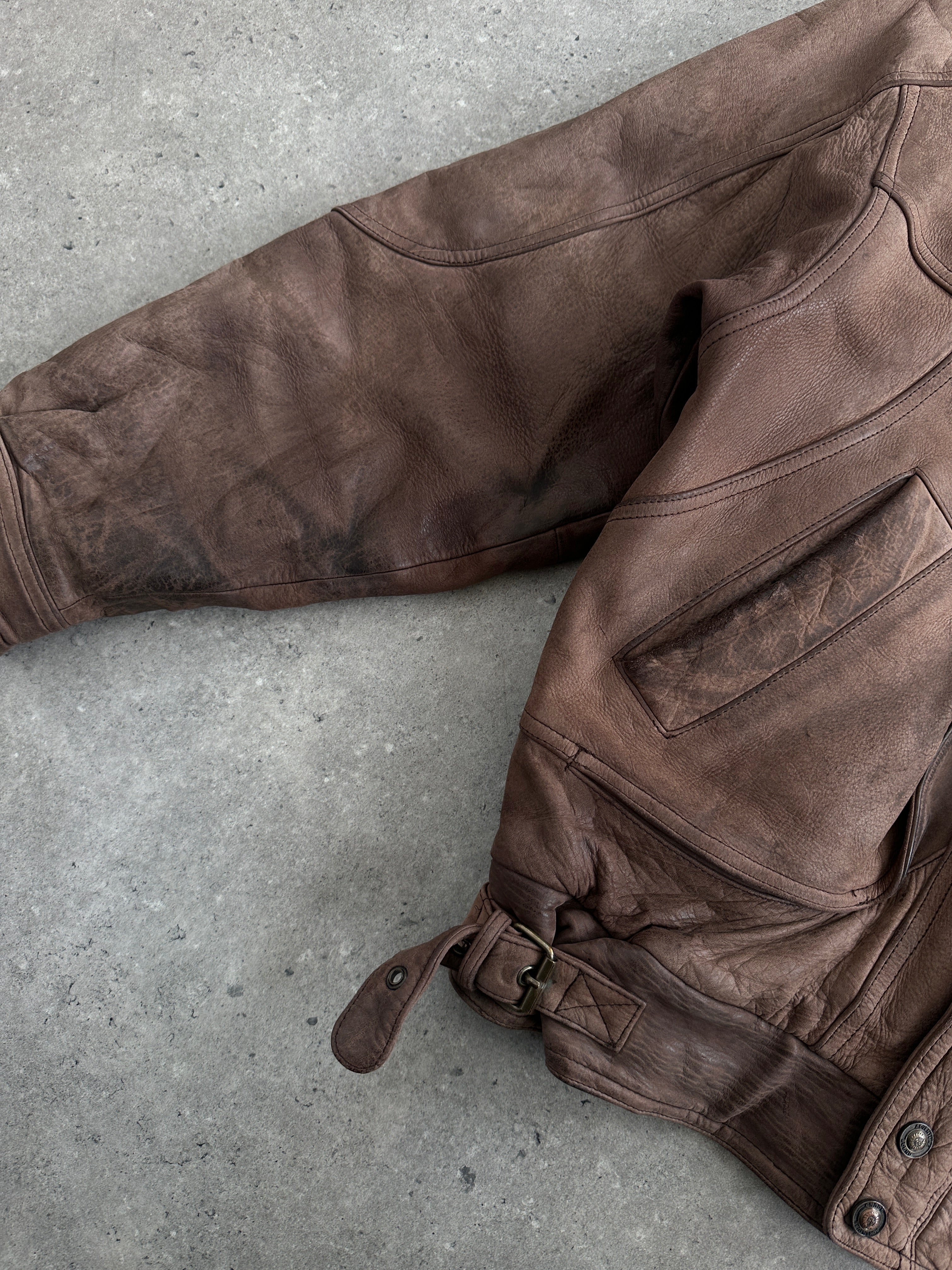 Vintage 1990s high neck aged leather bomber jacket, size large, featuring classic design and distressed leather texture.