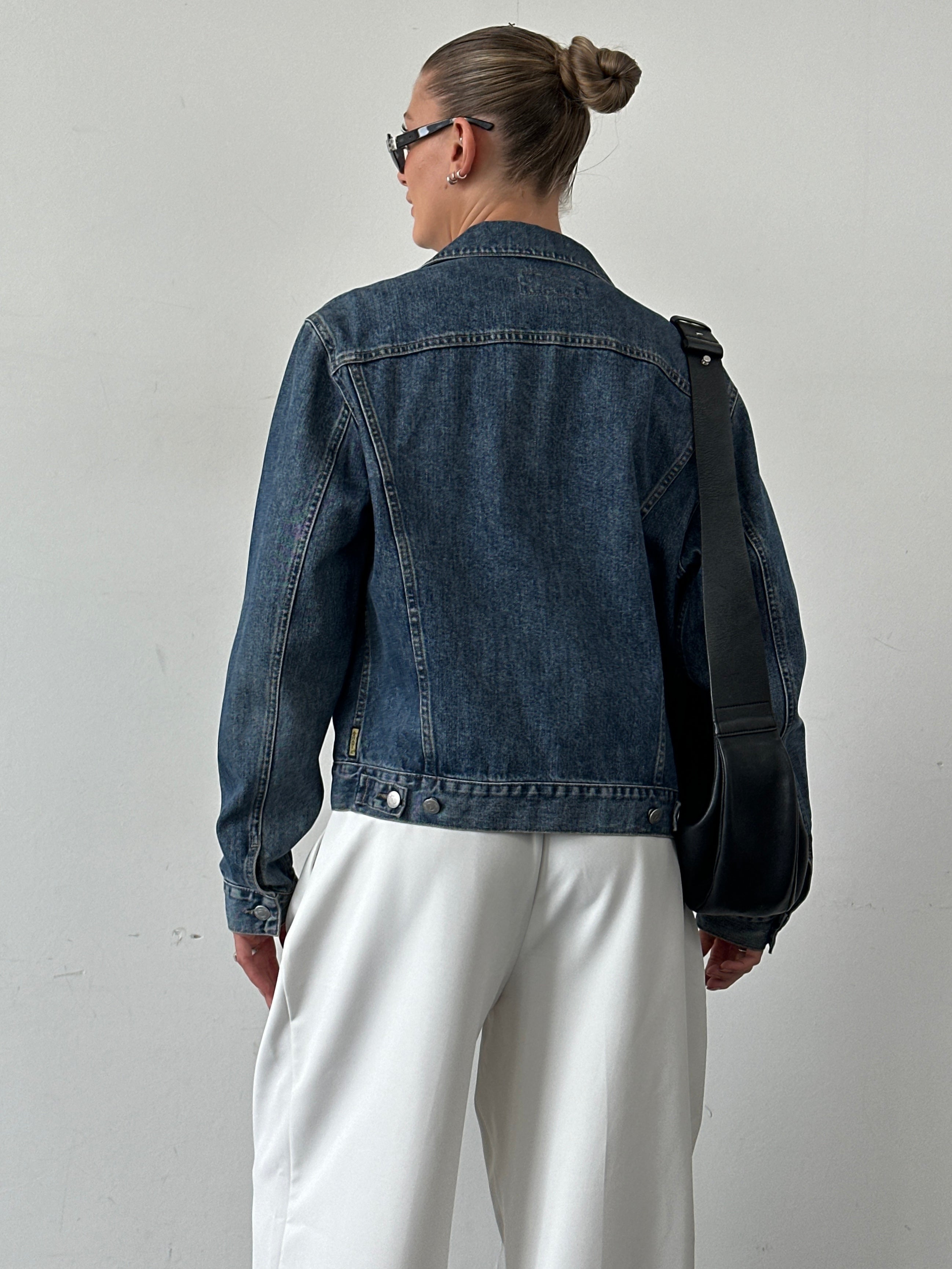 Armani Jeans denim jacket in size M featuring classic blue denim, button-up front, and chest pockets.