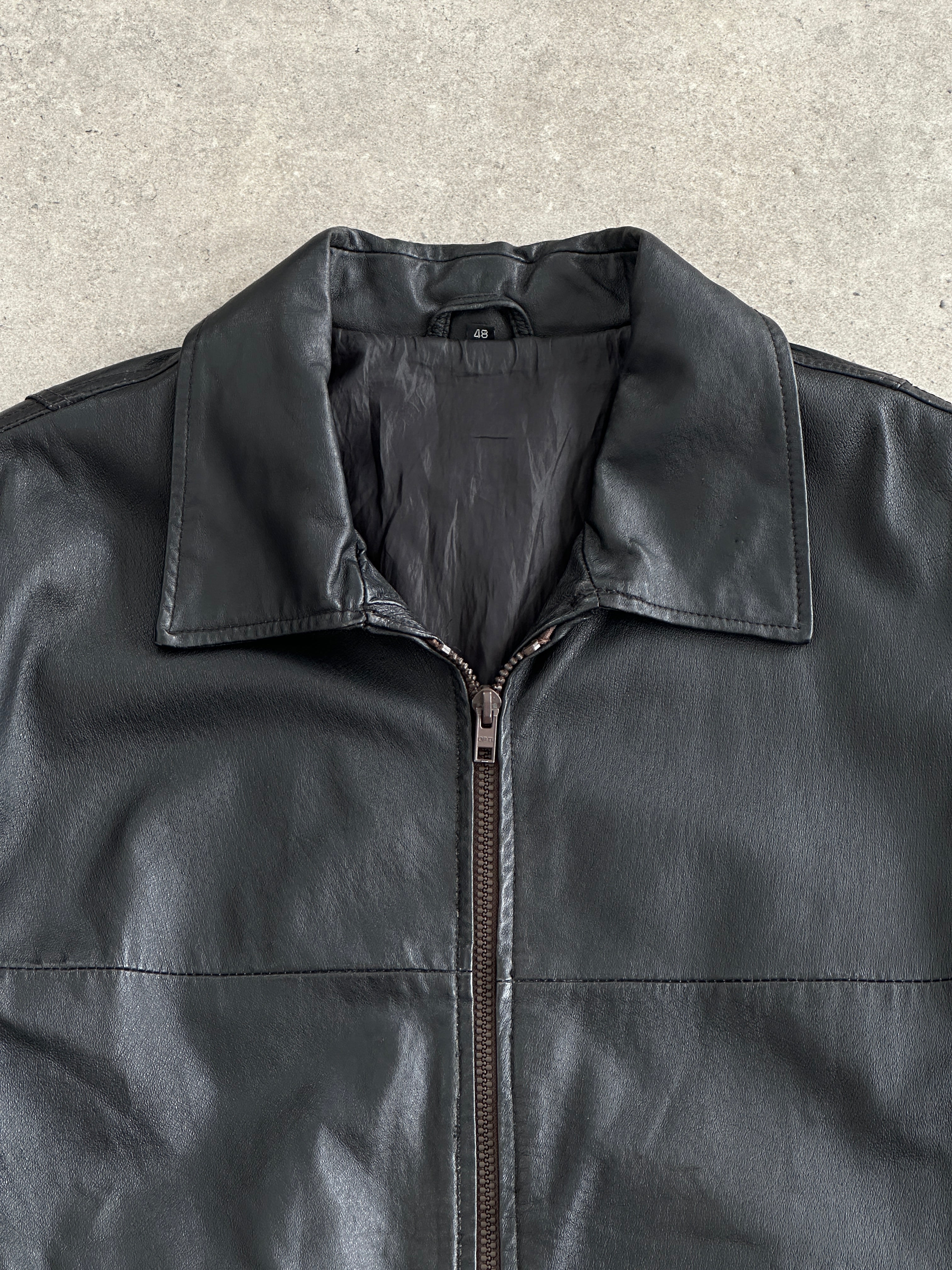 Vintage 1990s minimal leather jacket, large/extra-large size, featuring sleek design and authentic leather material.