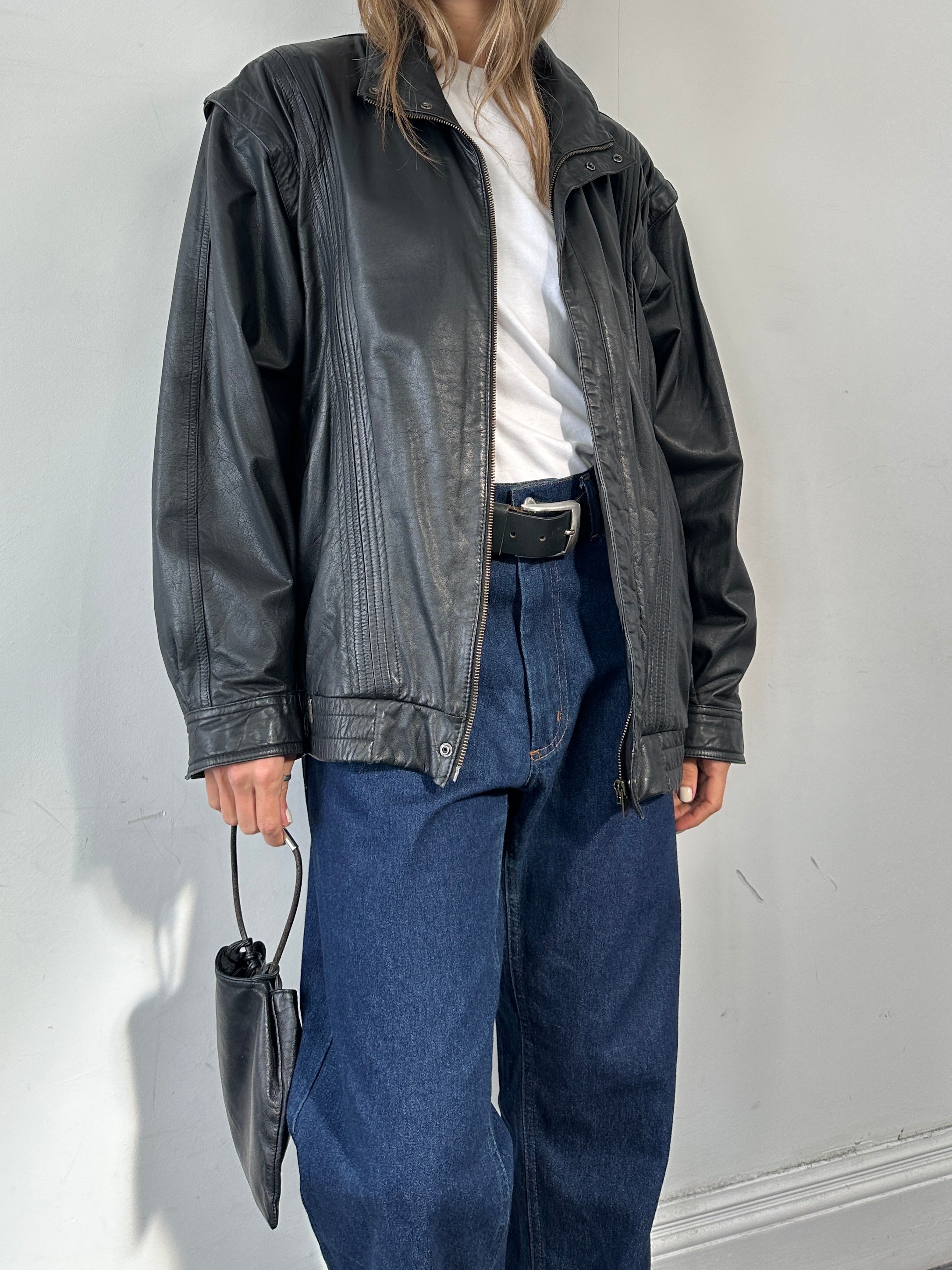 Vintage leather bomber gilet jacket in size XL, featuring classic design and distressed leather for a vintage look.