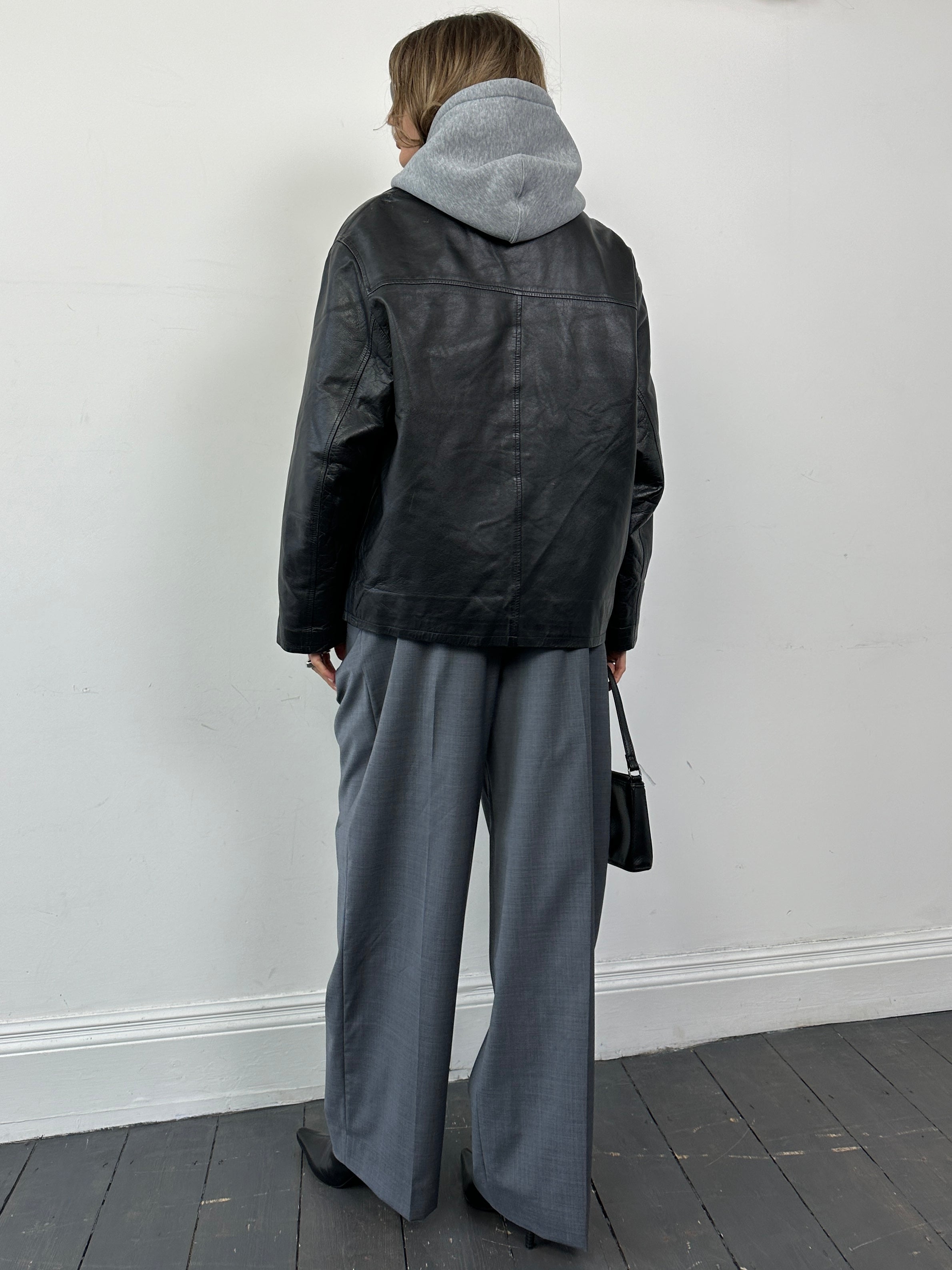 Conbipel zip-up leather jacket in size L, featuring a sleek design with a front zipper and smooth leather finish.