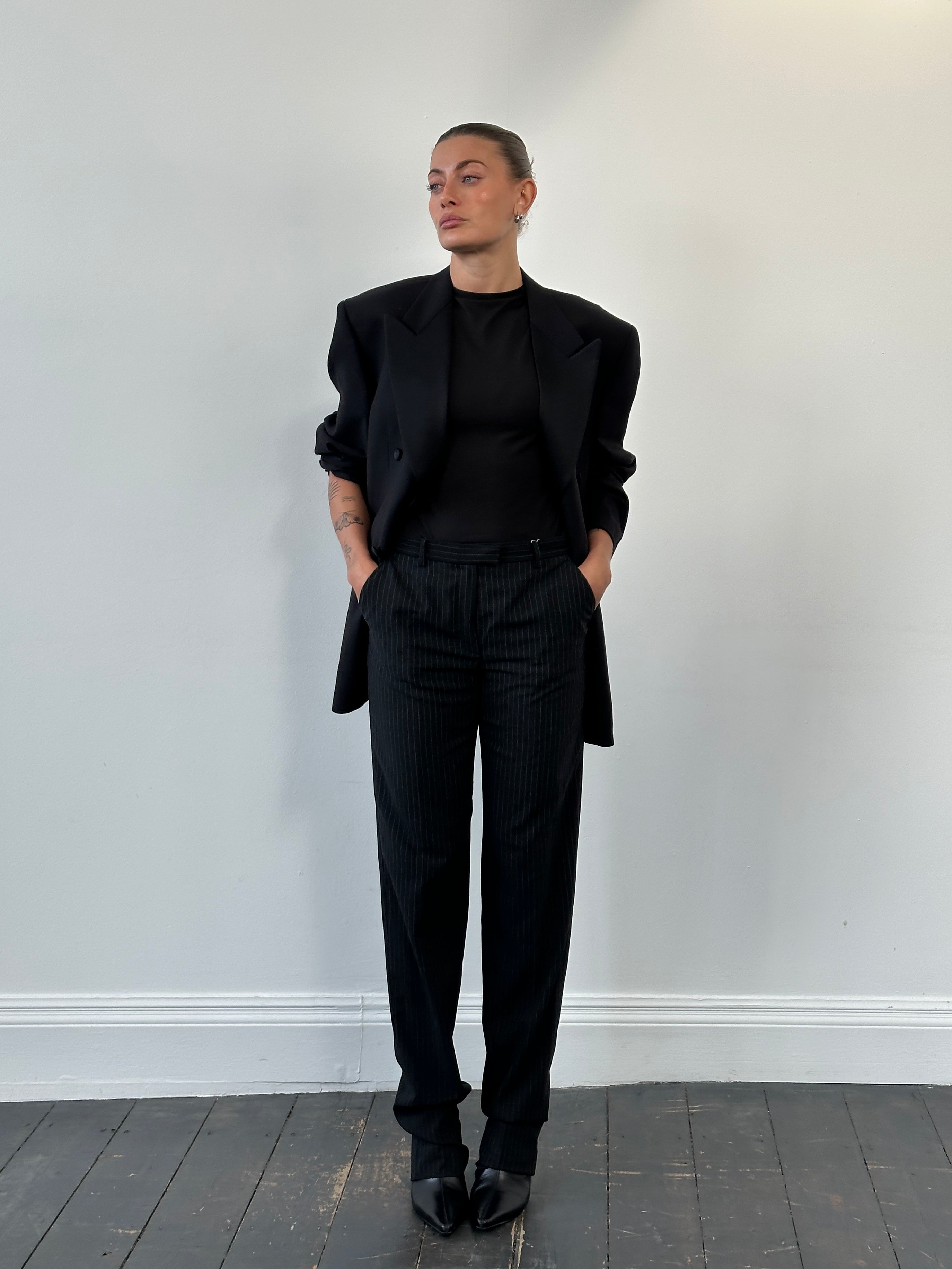Armani Collezioni 2000s pure wool tailored trousers with straight leg fit in size W28, displayed flat.