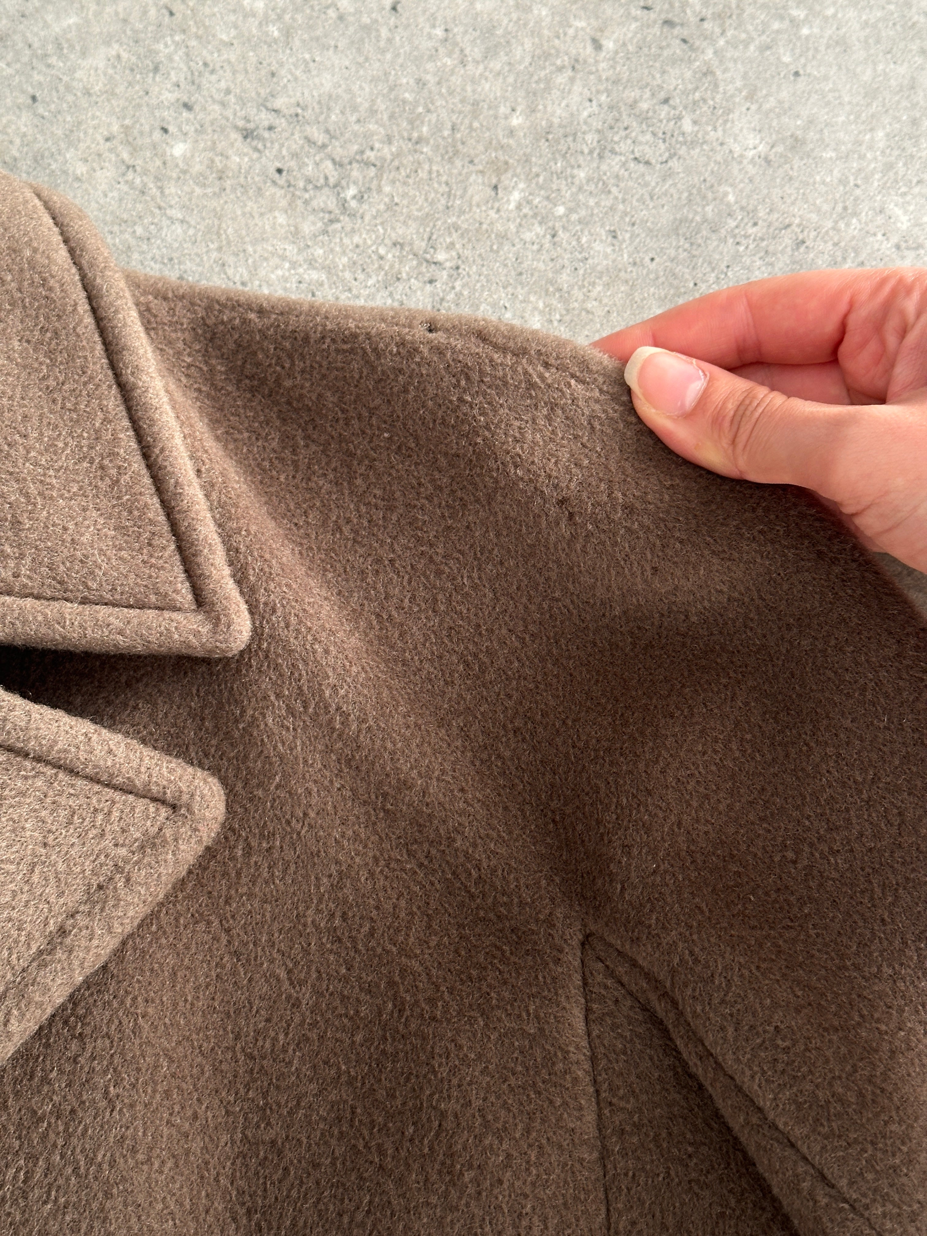 Max Mara pure wool double-breasted coat in size S, featuring a classic tailored design and button closure, shown on a model.
